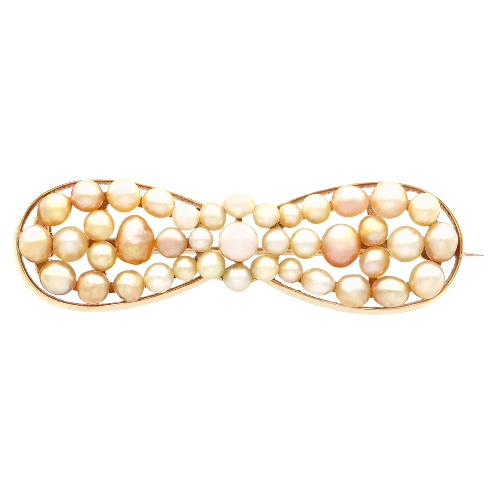 Broche ancienne en or jaune et perles naturelles