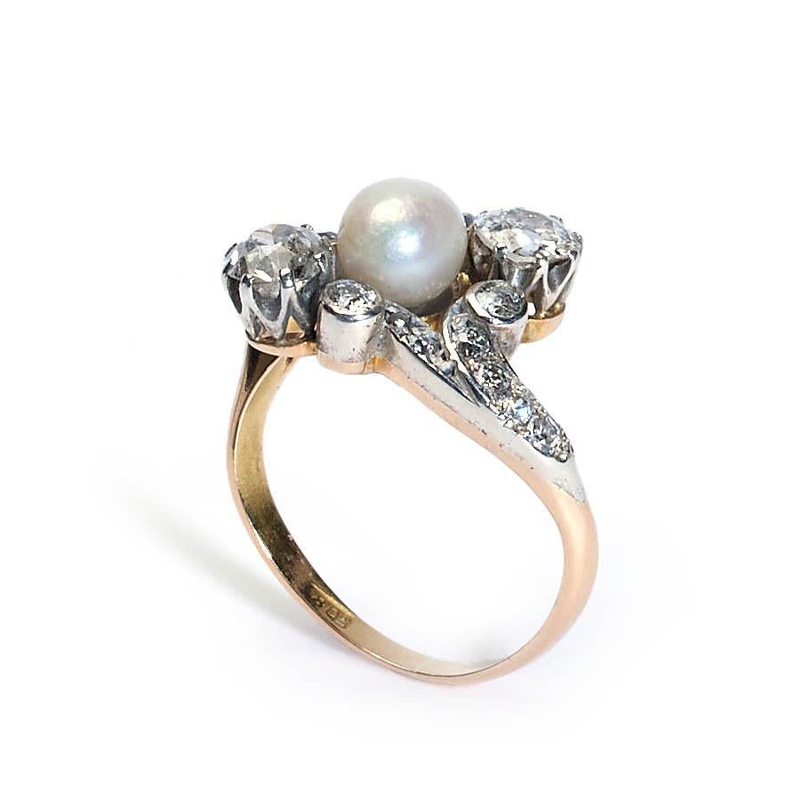 Belle Époque Antique Natural Pearl, Diamond and Silver Upon Gold Crossover Ring, Circa 1910 For Sale