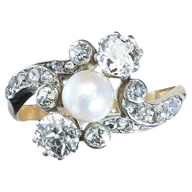 Antique Natural Pearl, Diamond and Silver Upon Gold Crossover Ring, Circa 1910 For Sale