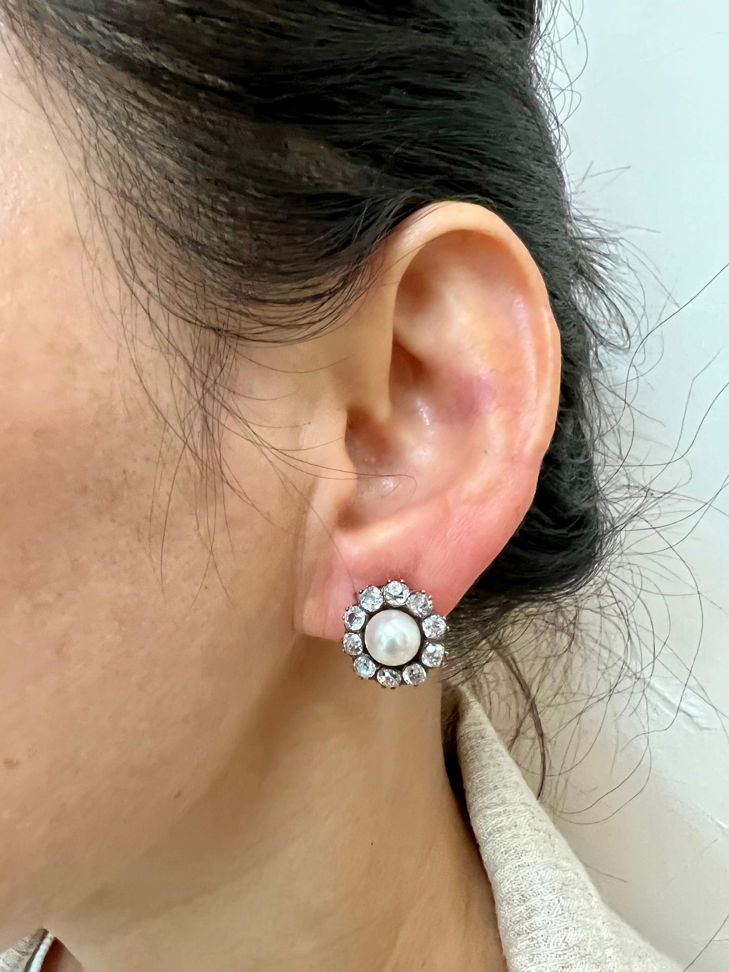 Please check out the HD video. These earrings are at least 100 years old! Still making a statement after all this time. In the center of each earring is one natural pearl surrounded by 10 old cut diamonds. The center pearls are about 7.2mm each. The
