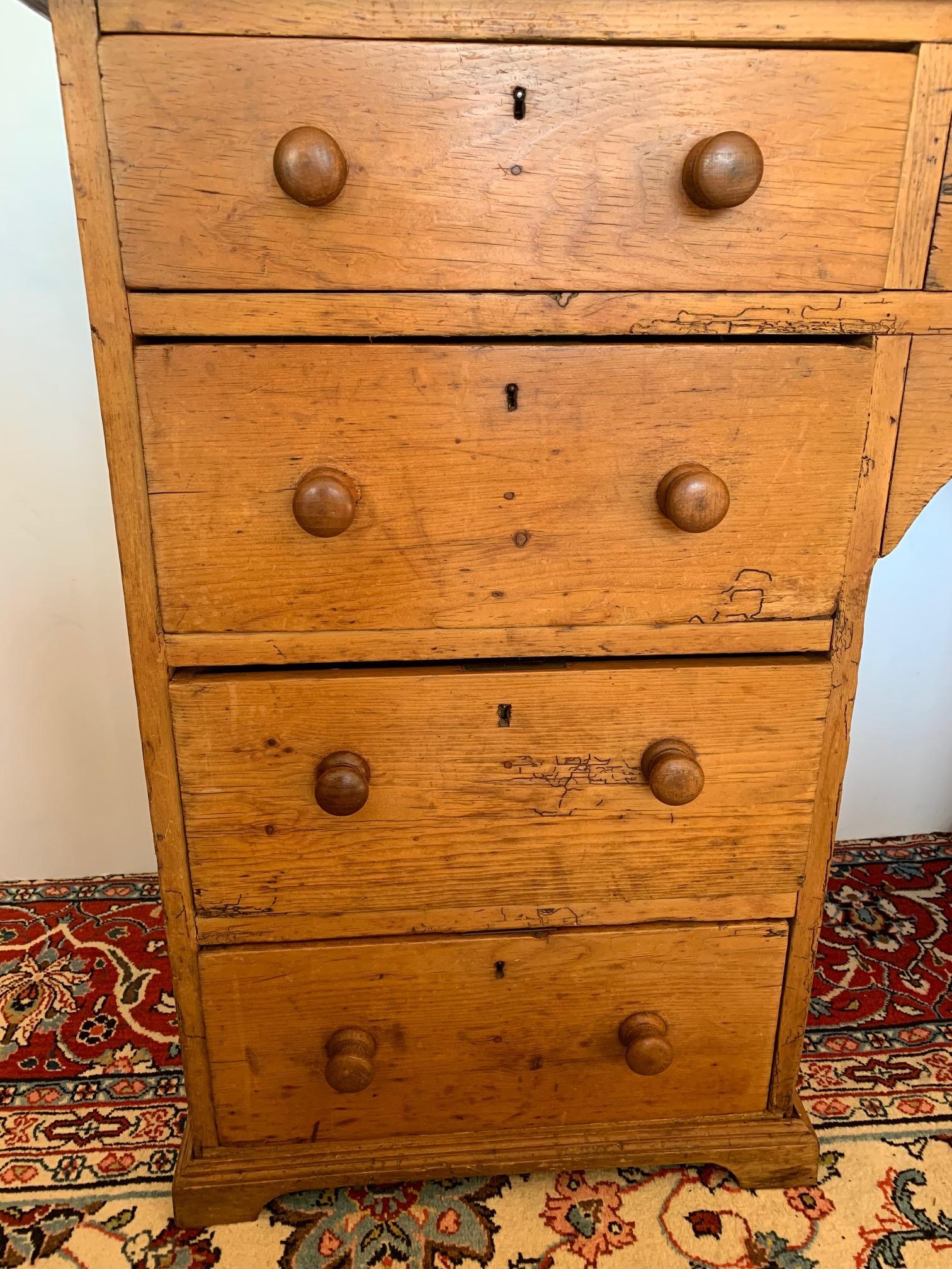 Charming antique weathered pine buffet, desk or chest of drawers. Has wonderful worming and patina.
Opening is 14.75 W 20 “ H to where the curve begins 24.25” to top
3 smaller drawers across the top
3 medium drawers on left side
2 larger, deeper