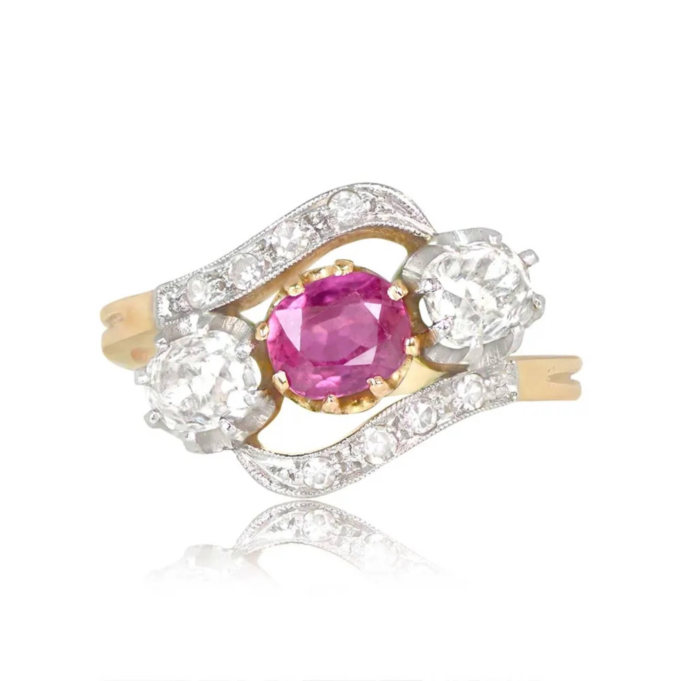 This original Edwardian-era ring showcases a unique design with three three-stone prong sets on an angle. The center stone is a stunning antique cushion-cut natural ruby, weighing approximately 0.75 carats, adding a touch of rich red elegance.