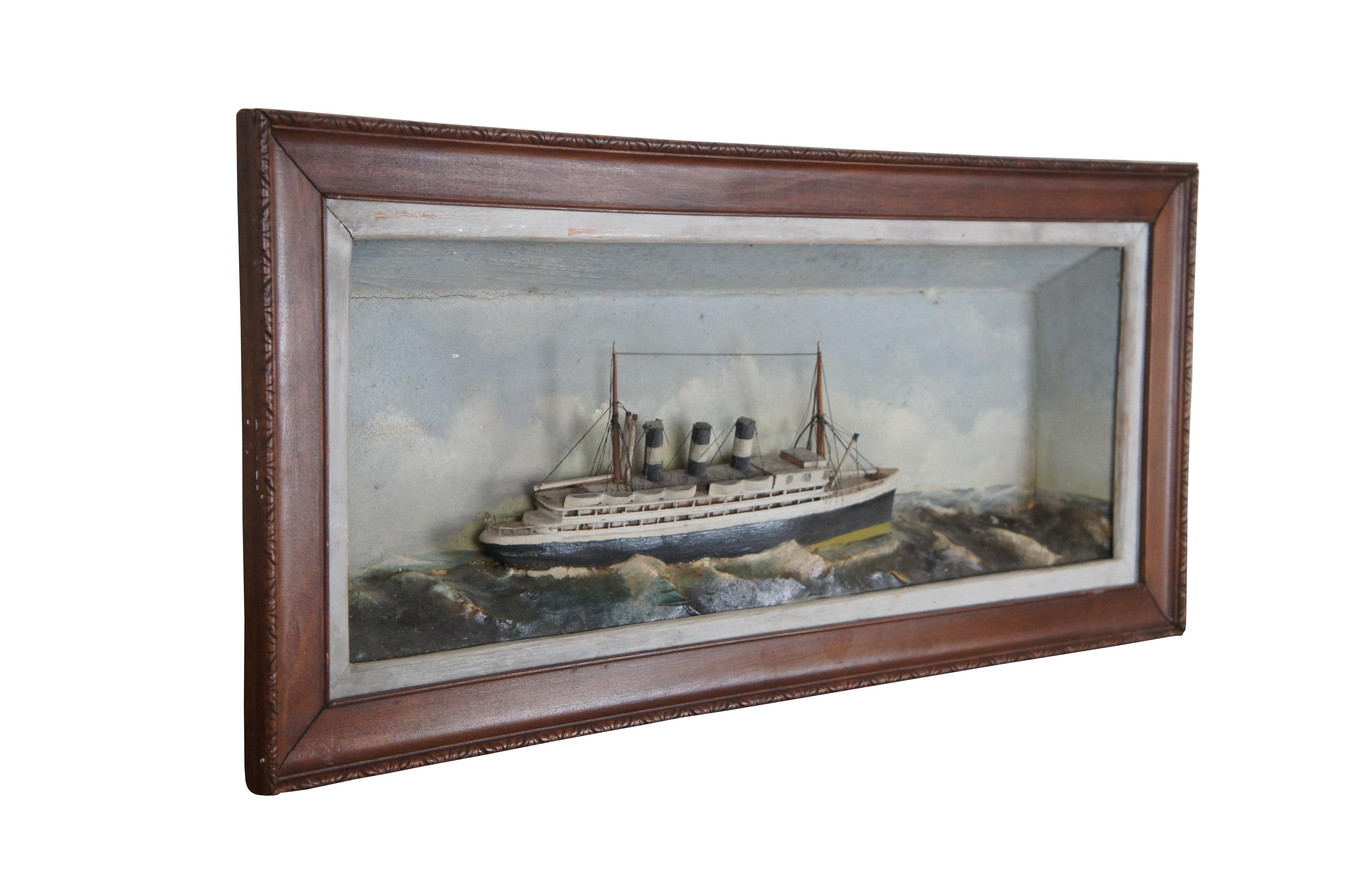 Antique three dimensional folk art diorama portraying a steam boat /  oceanliner / ship on a choppy sea. The model is set in a rectangular shadowbox with white trim and brown wood frame with carved border.

Dimensions:
26.5