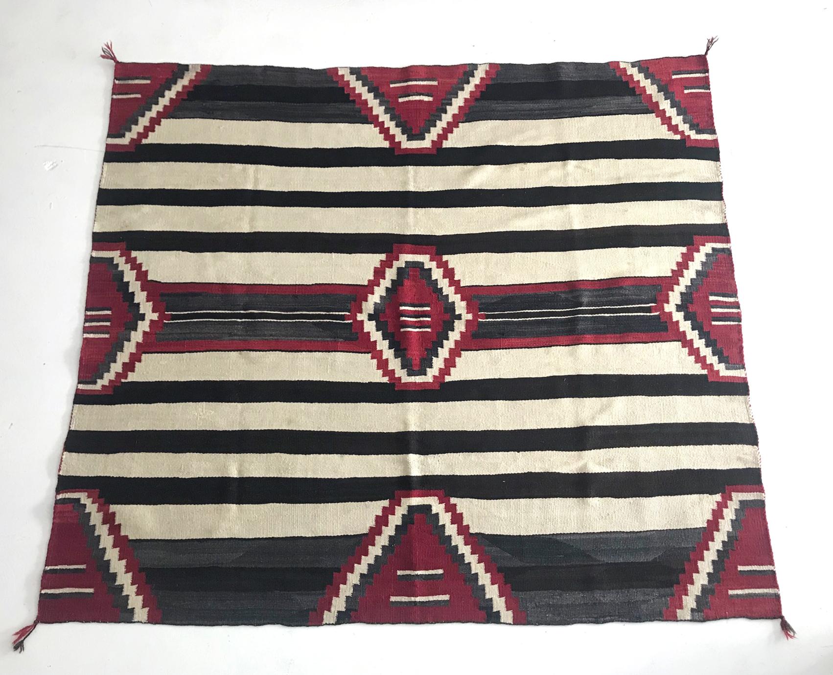 On offer is a Navajo chief blanket of the third phase circa 1895-1920s. The chief blanket is the highest achievement of the Navajo textile development, and this is a wonderful example of the high quality. Woven from off white, brown handspun sheep