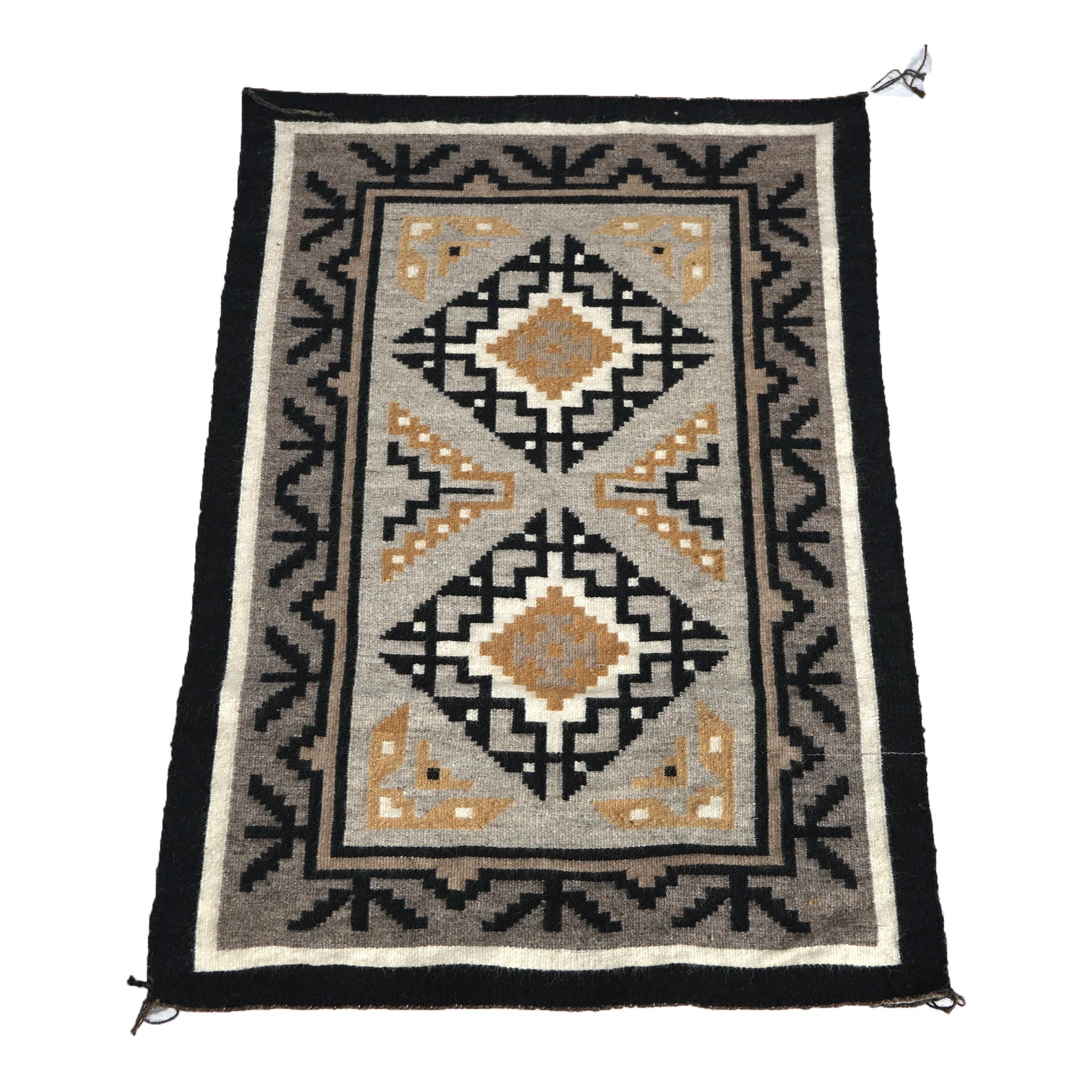 An antique  Navajo German Town Native American Indian rug offers wool construction with double medallion, circa 1930

Measures - 37.5