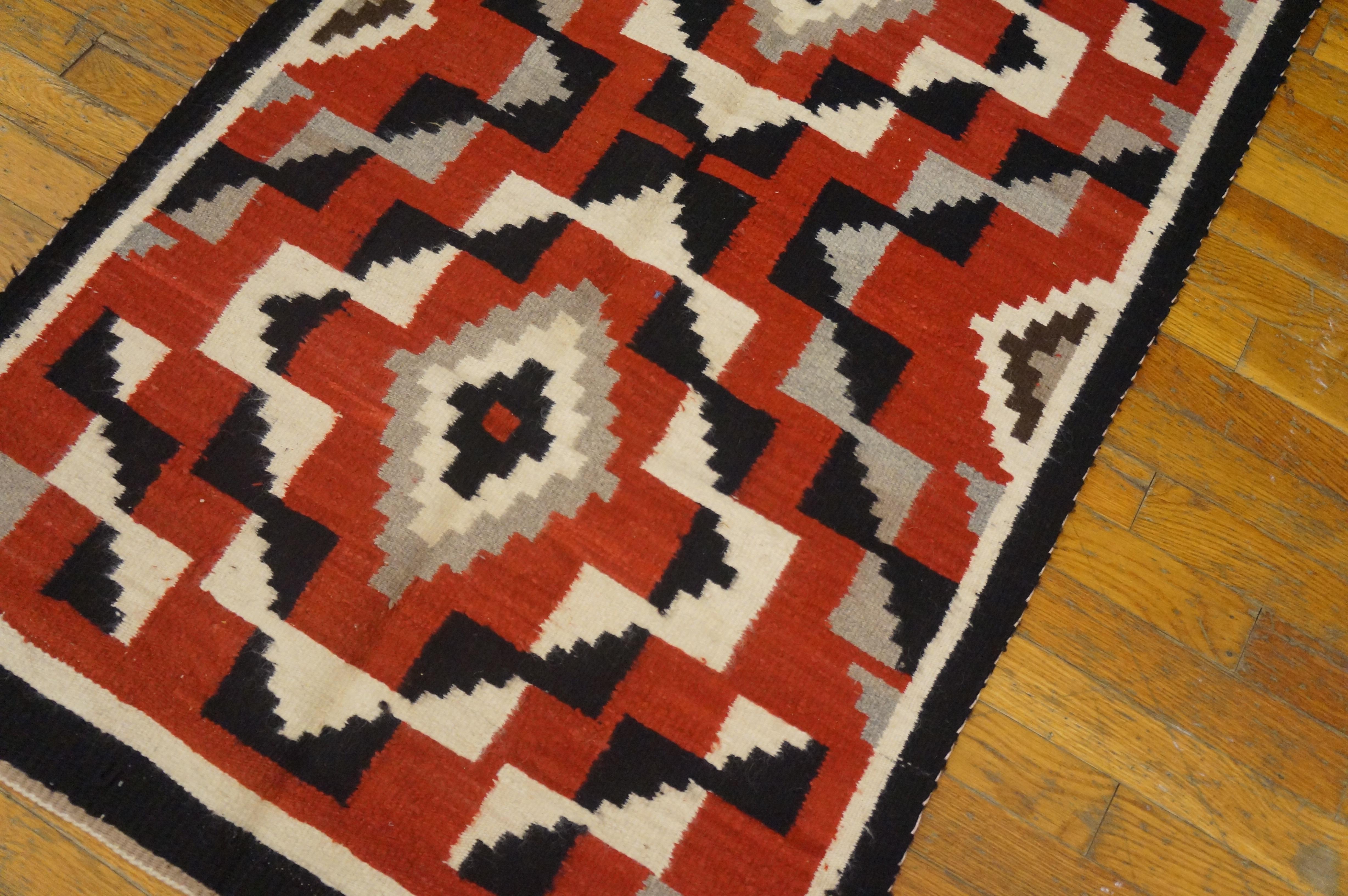 Antique Navajo rug with geometric design and size: 2'8