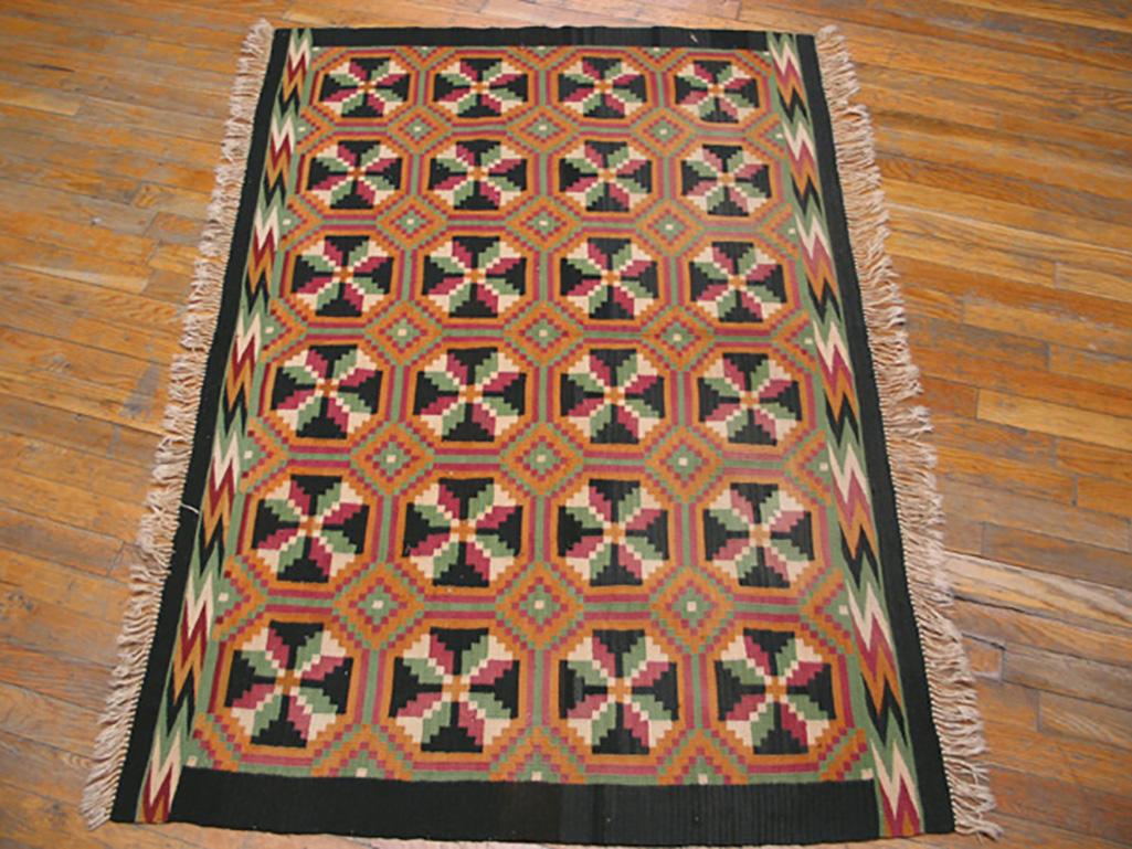 Looks Scandinavian, with four columns each of six octagons with stylized floral cruciform centers., set into an orthogonal lattice with nested orange and red lozenge cross points. Complex chevron side borders only. This is an apparently unique