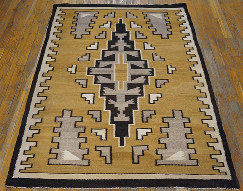 A very unusual camel-gold field displays a quasi-Caucasian tall charcoal medallion with a grey “backbone”, within an ivory stepped meander border and grey notched corner triangles.  Well-woven. Excellent condition. 
      