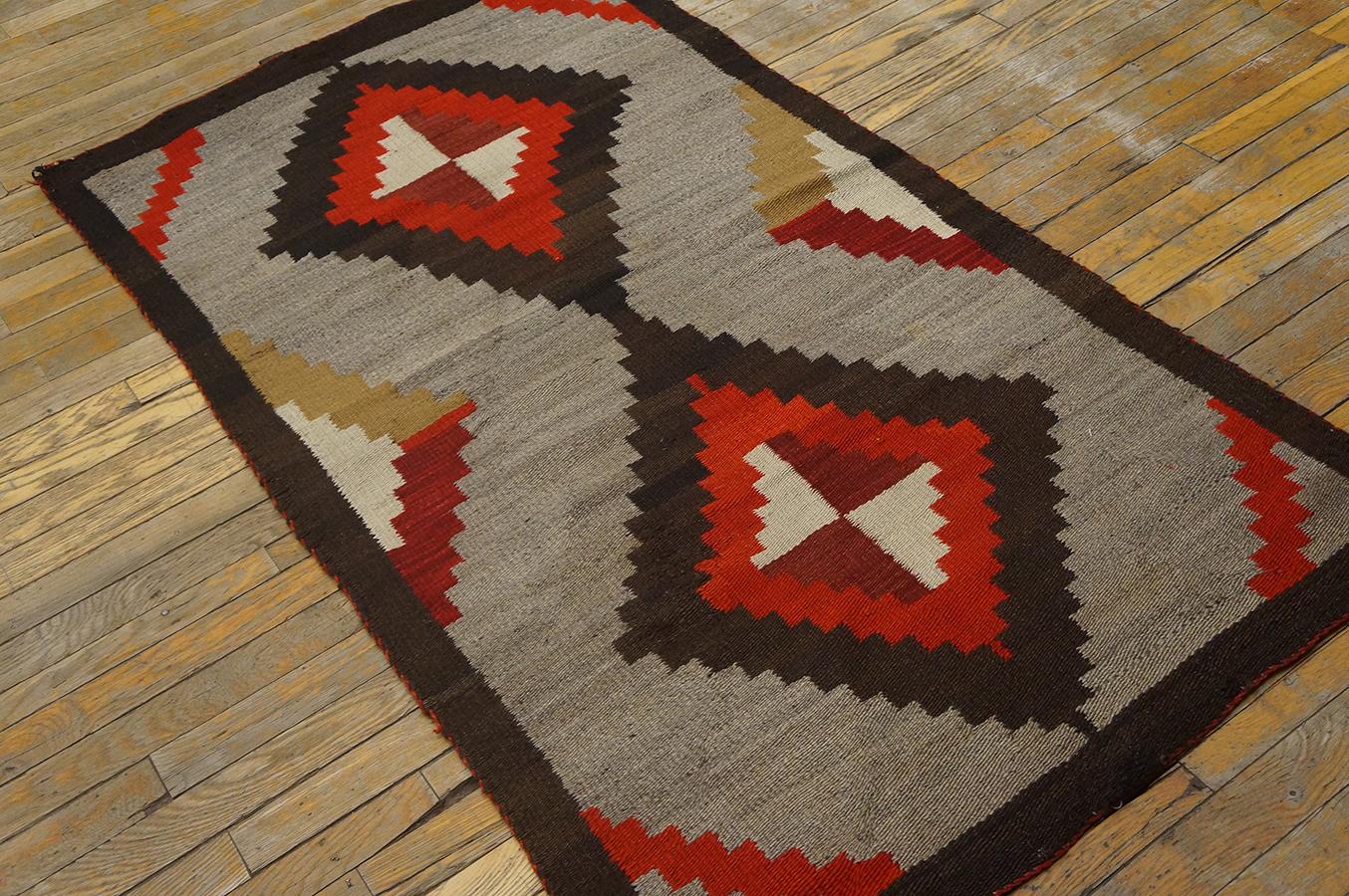 Antique Navajo rug with geometric design and 3'11