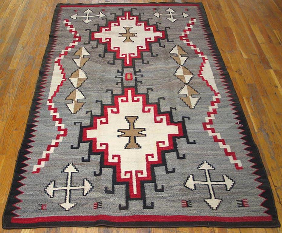 Maybe Teec Nos Pas, but surely influenced by Caucasian weaving, but with a classic Navajo palette emphasizing flannel grey, ecru, black, camel and red. The abrashed field shows two lightly connected, multiply stepped and hooked panels with ecru