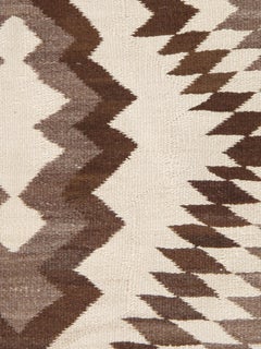 Antique Navajo rug circa 1930 two-tone brown diamond zigzag pattern natural wool