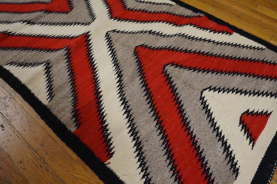 Antique Navajo rug with geometric design and size 2'8