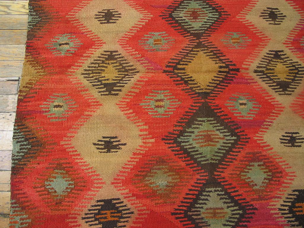 Antique Navajo rug with red color and 3' 8'' x 4' 1'' size. This almost square small Southwestern tribal scatter shows a soft rust-red ground with three columns of comb-fringed, poled and nested diamonds in charcoal, sandy beige and camel-straw. Has