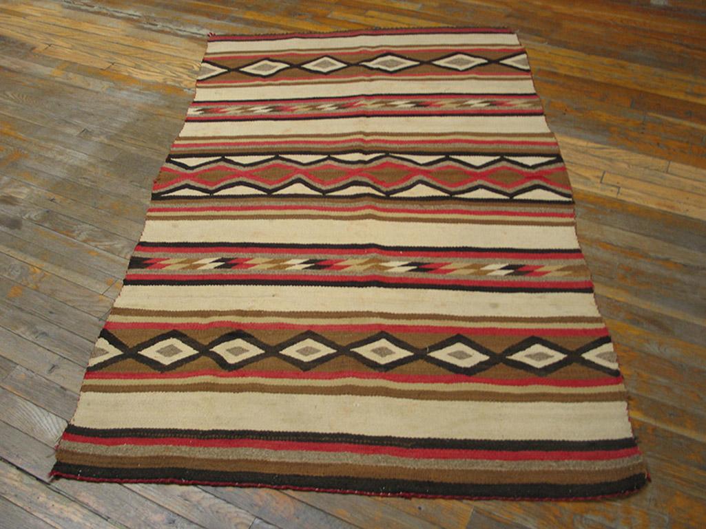 The robust red and creamy ivory contrast in this wide ruins blanket style scatter. The pattern is based on horizontal zig-zags, making a lozenge chain or creating triangles. Narrow bands of doubled parallelograms are an additional feature as they