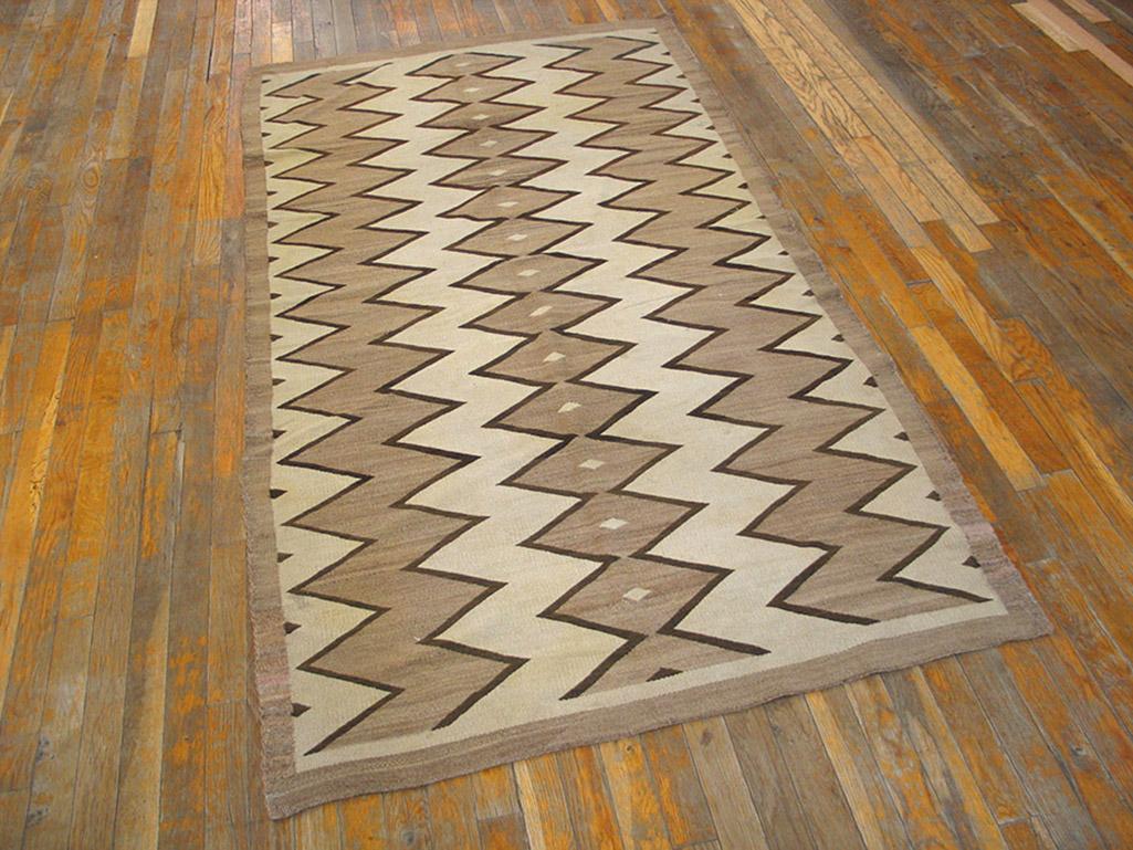 Antique Navajo rug with Geometric design and 3' 9” x 7' 2” size.