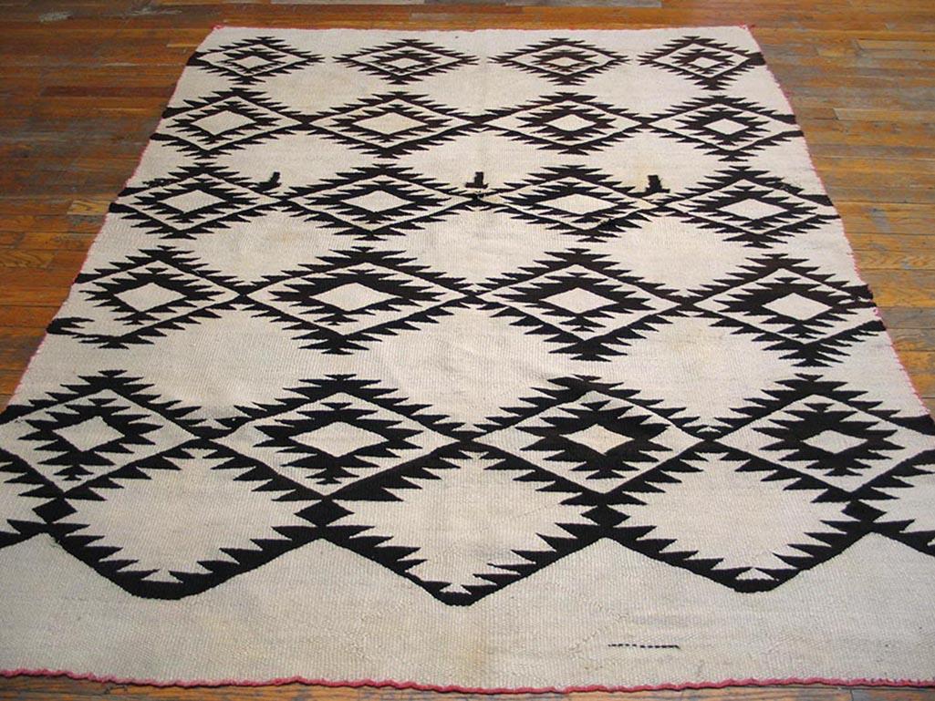 Antique Navajo rug with ivory color background and all-over pattern, measures: 5' 0” x 6' 6”.