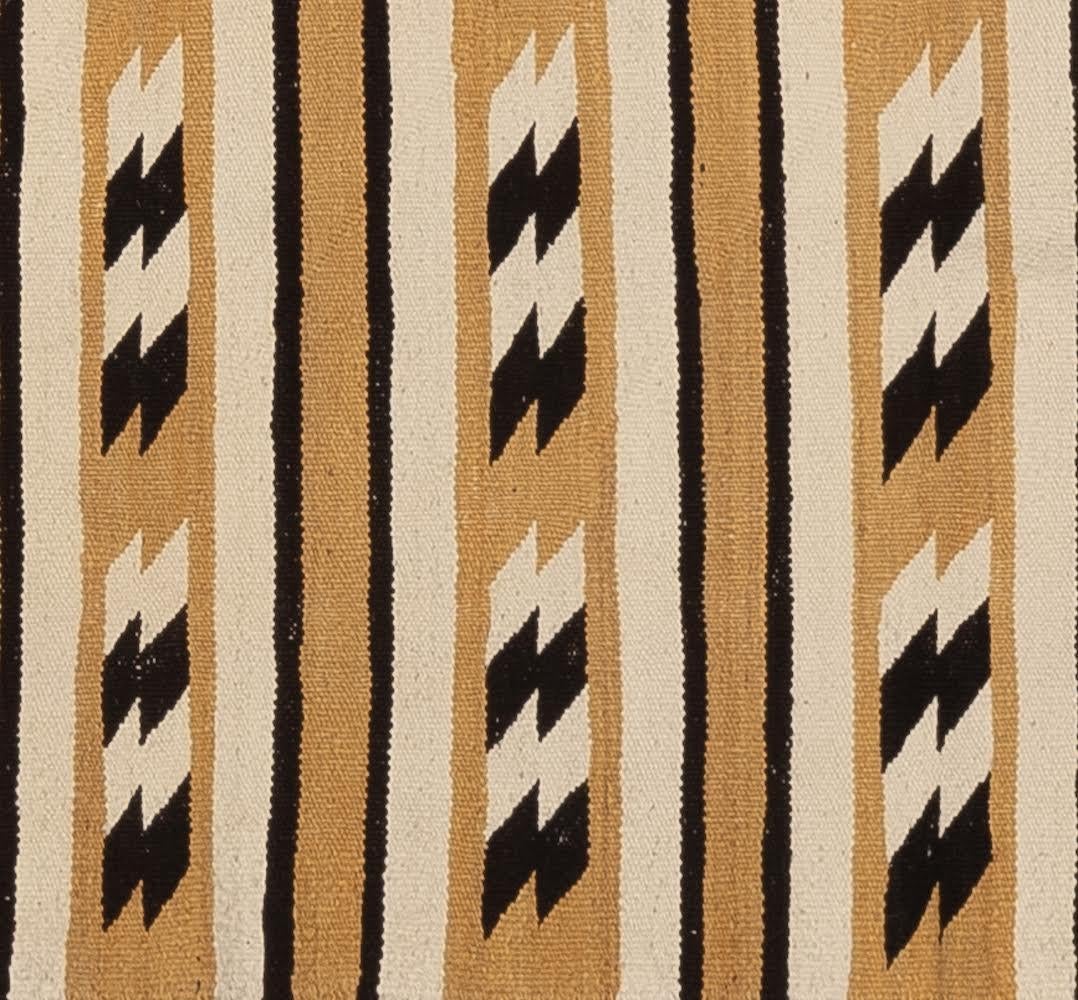 It is truly rare to find a one-of-a-kind antique that survived in the excellent condition as this rug has. The talented Navajo weaver wove this with wool yarns that were dyed with aniline dyes, natural dyes, and natural fleece colors. The weave is