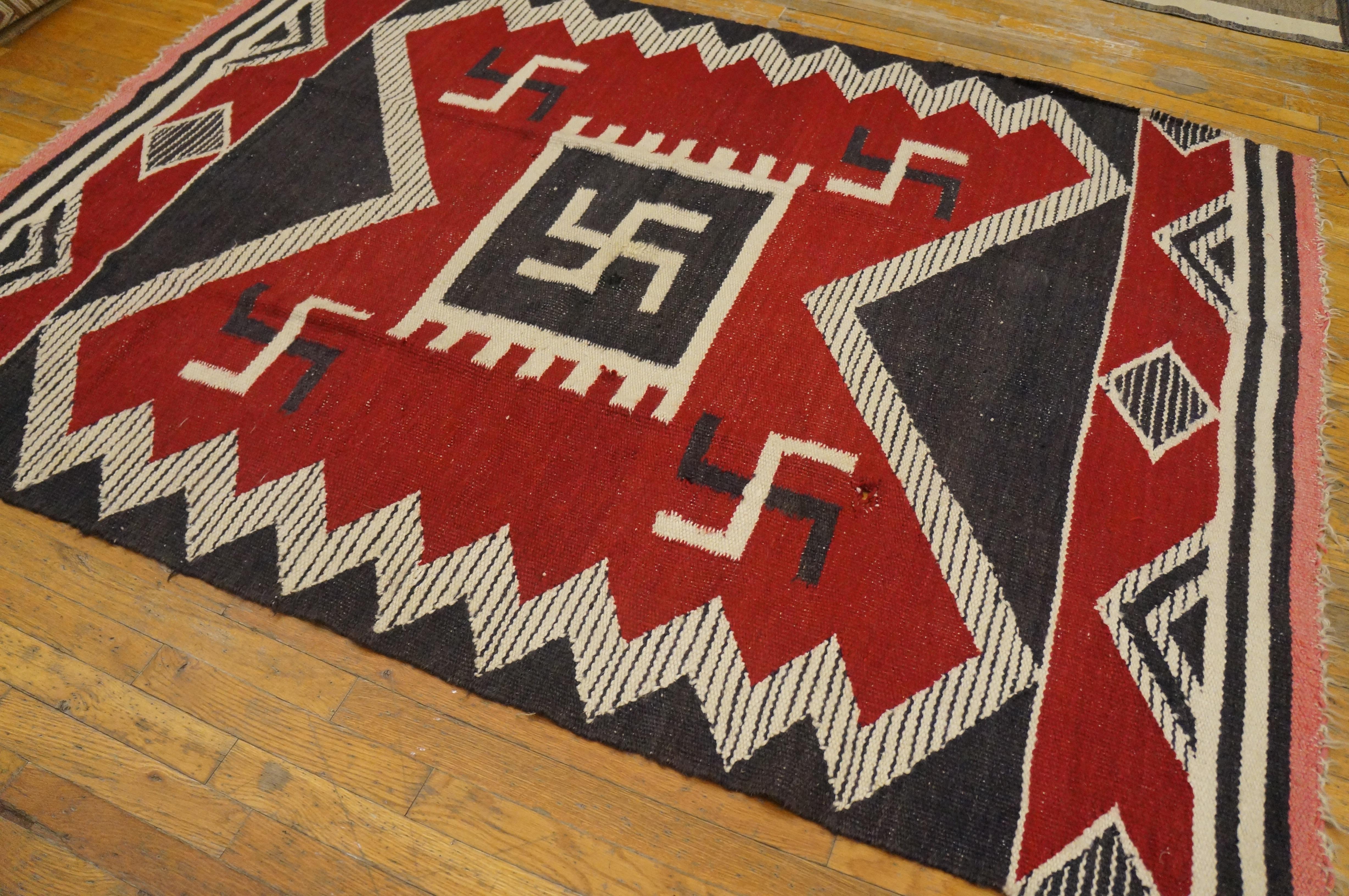 Antique Navajo rug with red color and 5' 0