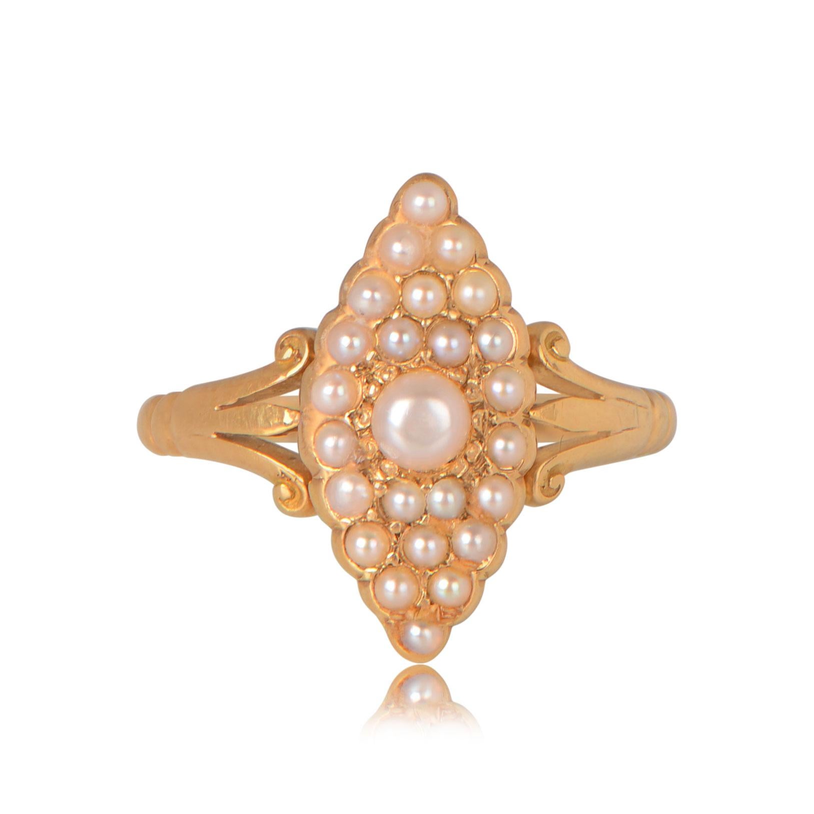 Antique Georgian Navette Ring: This captivating piece showcases a cluster of seed pearls in a navette design, capturing the essence of the era. Handcrafted in 18k yellow gold, this ring's timeless elegance dates back to approximately 1815.


Ring
