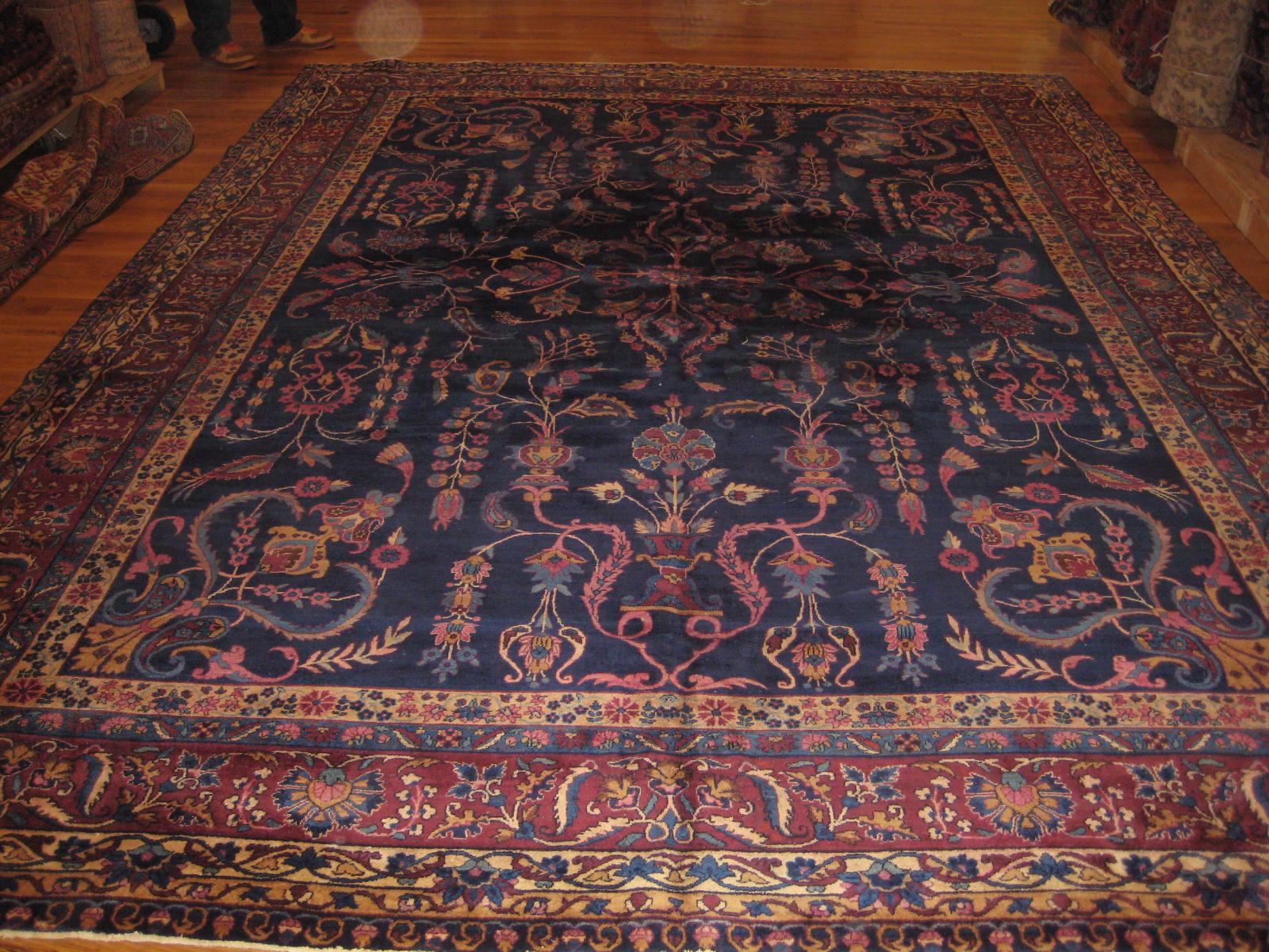 Wool Antique Navy Blue and Gold Floral Persian Kirman Rug, circa 1920s-1930s For Sale