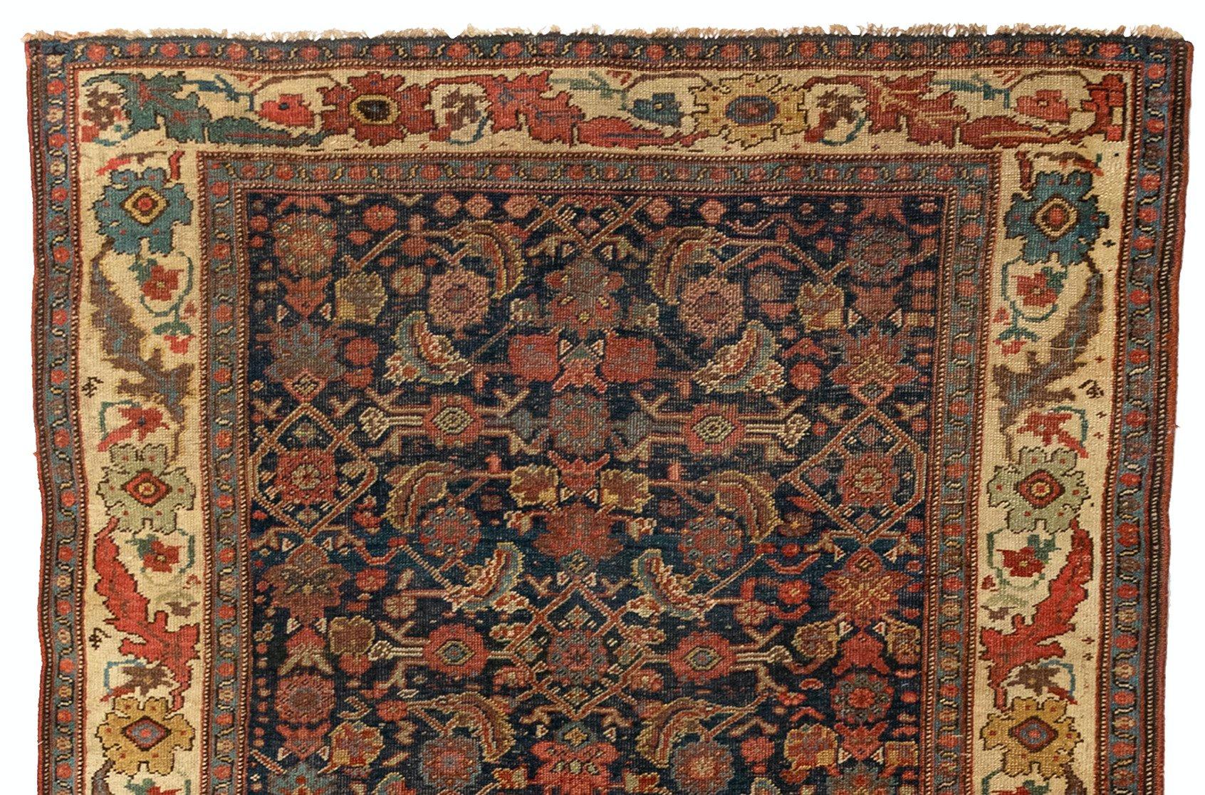 This is a lovely antique navy blue and ivory Persian Bijar rug hand knotted in Iran in the 1900s and measures: 4.6 x 12.2 ft.

Bijar rugs are mainly woven in the town of Bijar and its surrounding villages. Bijar is located in the province of