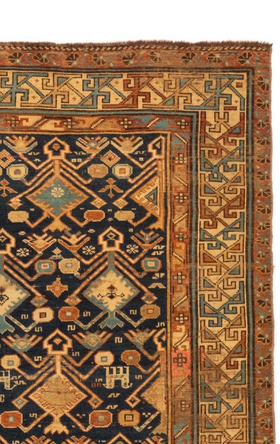 Antique Navy Blue Ivory Gold Geometric Tribal Caucasian Dagestan Rug circa 1940s In Good Condition For Sale In New York, NY