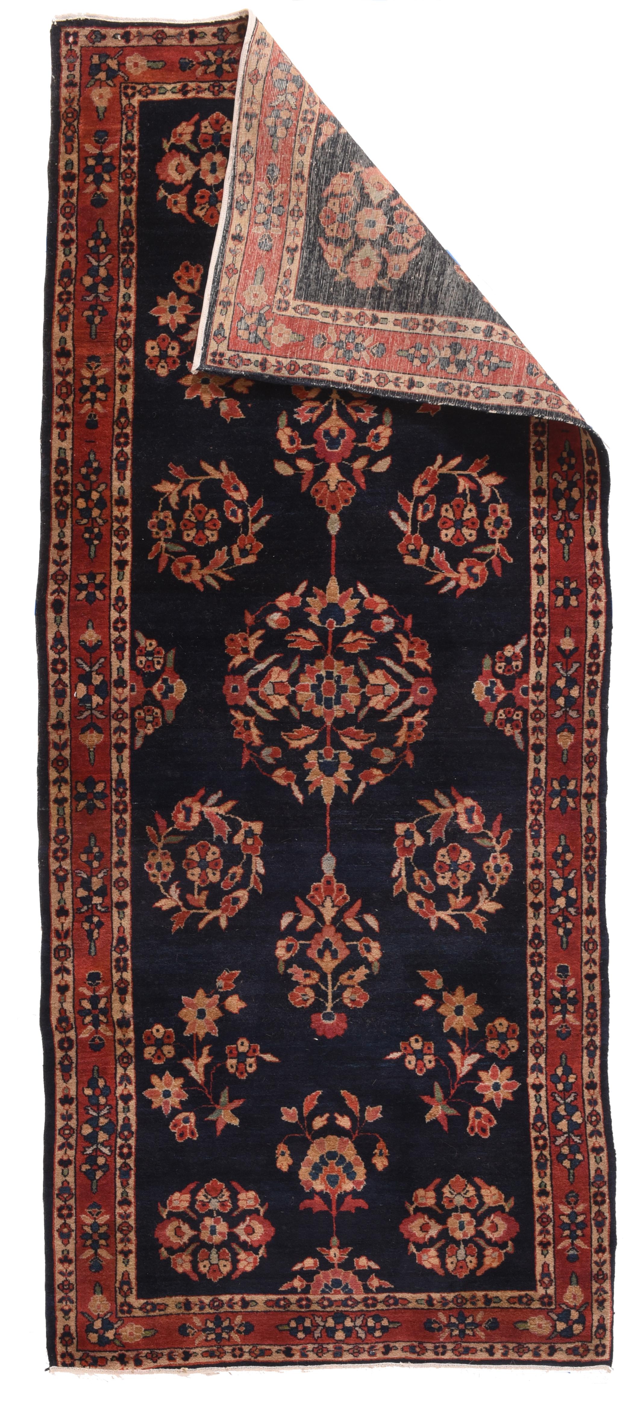 Antique Navy Mohajeran Sarouk Rug 2'9'' x 6'8''. Perhaps Mohajeran village which was famous for very high quality, blue ground Sarouk style rugs in the Interwar period. The intense navy indigo field show spaciously positioned rosettes, wreaths,