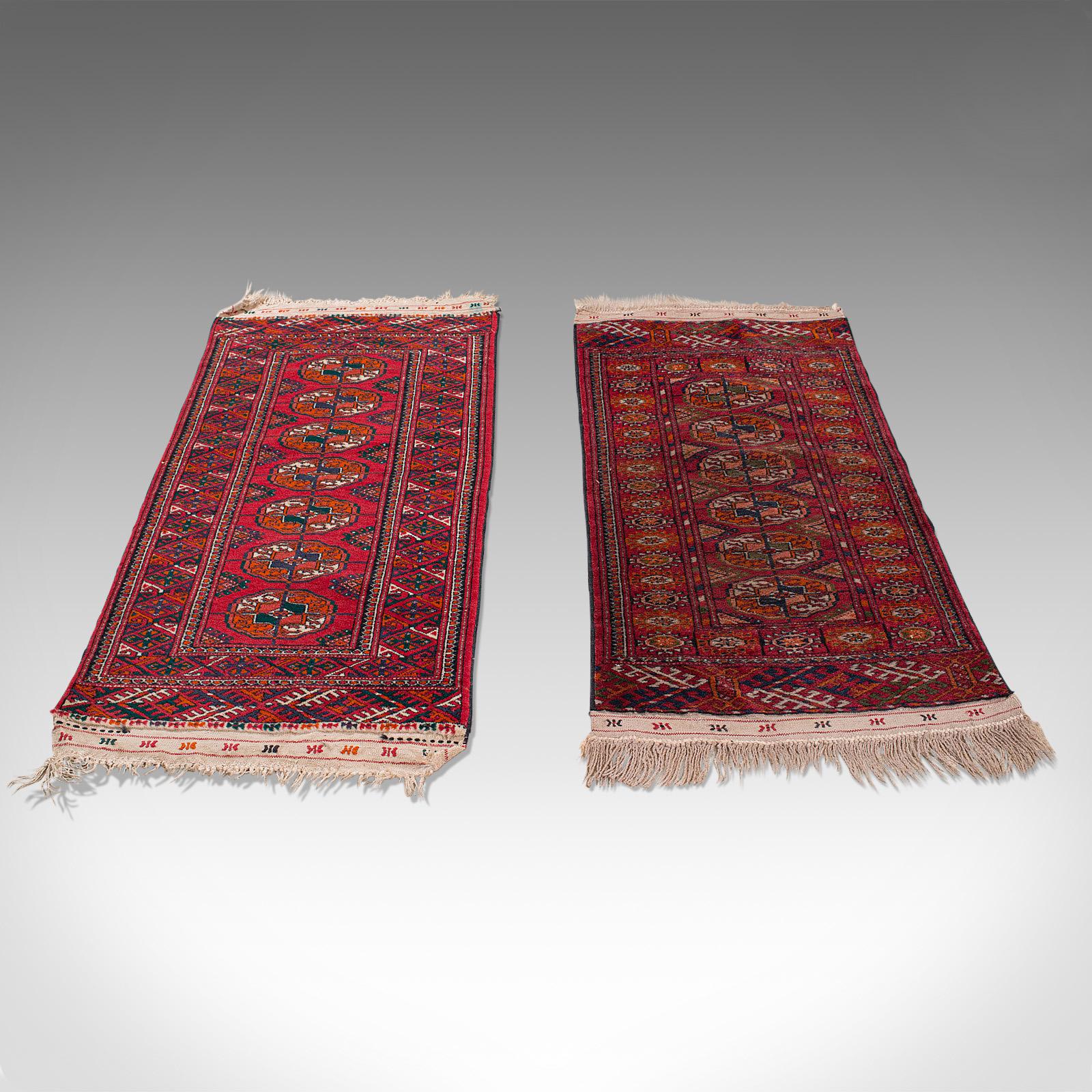 This is an antique near-pair of Bokhara rugs. A Middle Eastern nomadic Turkoman or Tekke carpet or wall covering, dating to the early 20th century, circa 1910.

Rich colors and fascinating patterns for this brother and sister pair
Displaying a