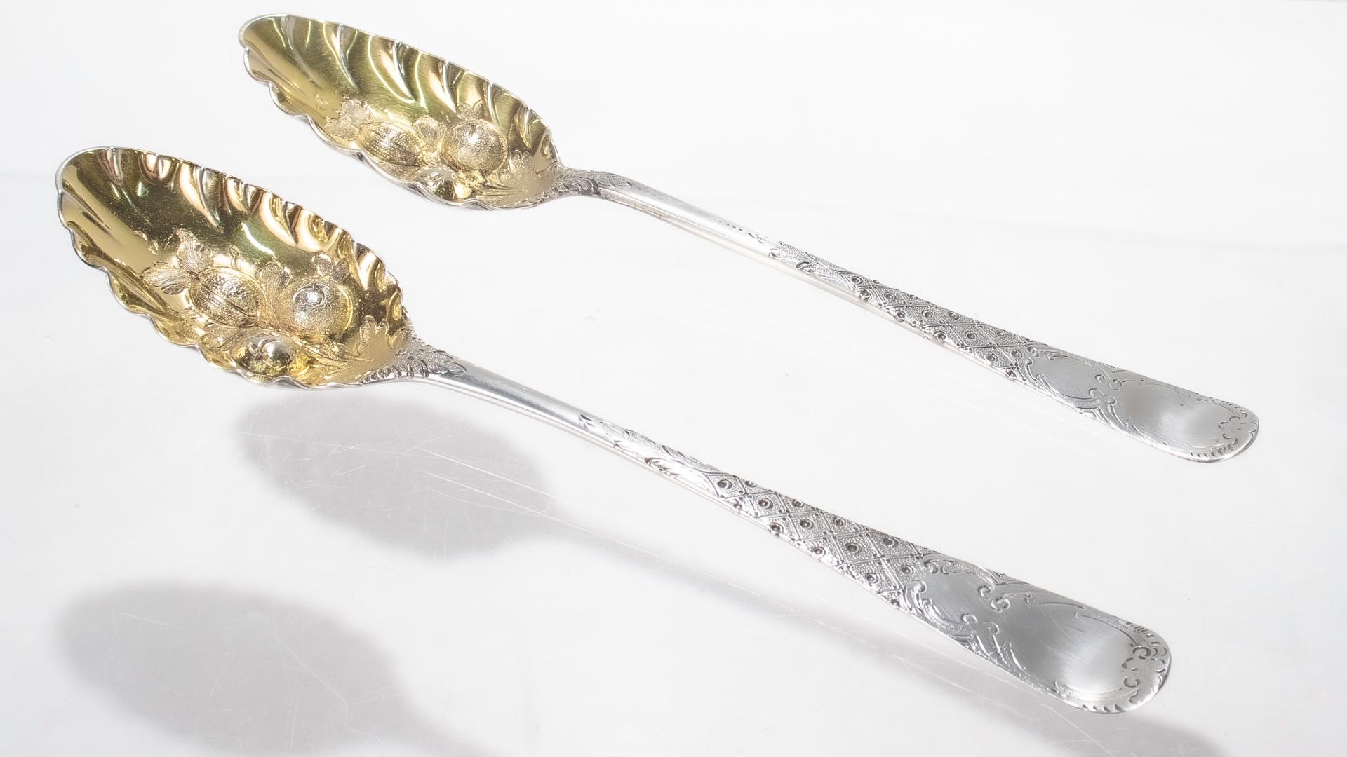 Antique Near Pair of Georgian Sterling Silver Gilt Decorated Berry Spoons For Sale 1