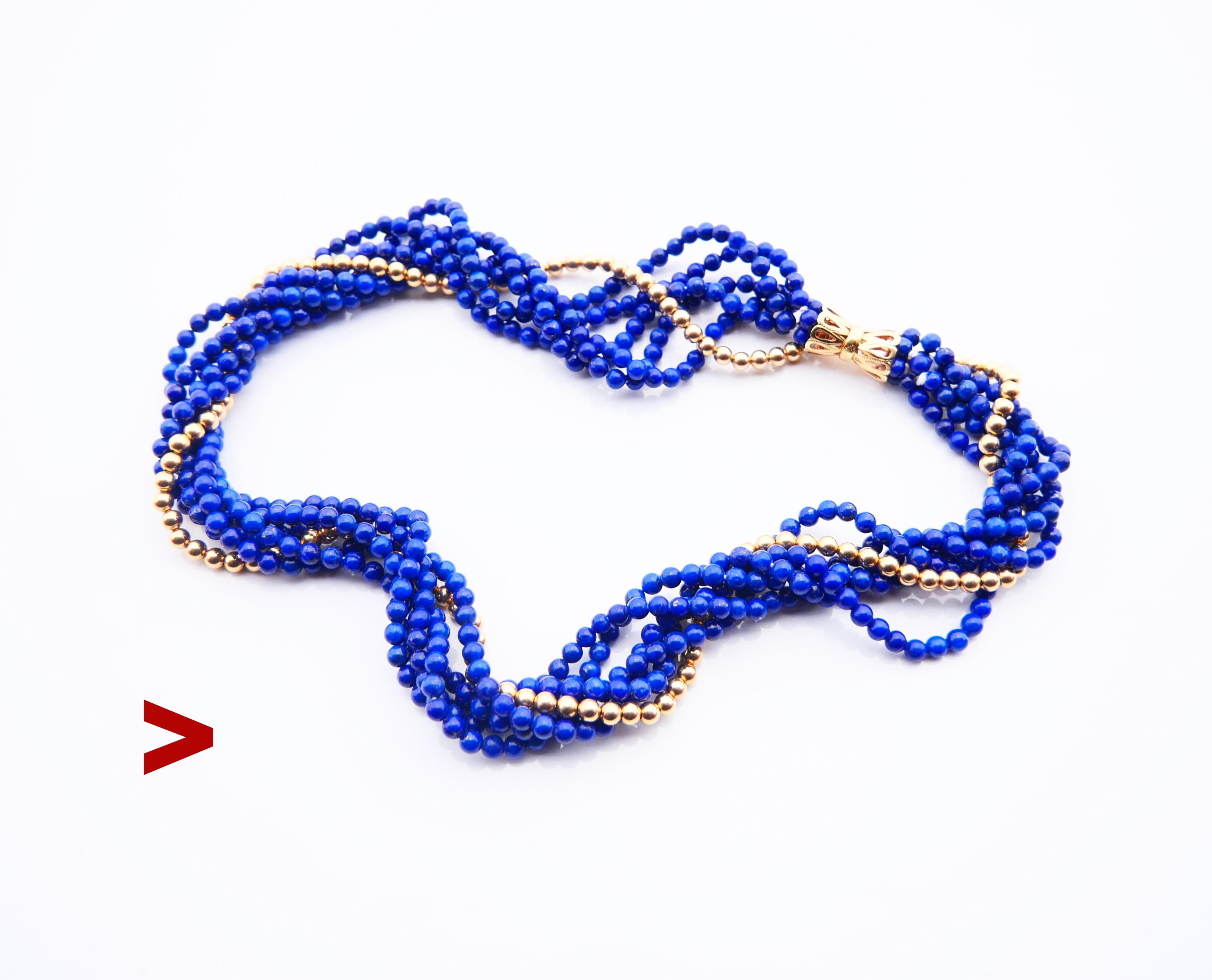 Necklace with 5 strands of numerous equally sized round cut Ø 4mm beads of natural Lapis Lazuli stone bound with one row of solid 14K beads of the same diameter. Ornamental openwork V-lock also in solid 14K Yellow Gold.

Hallmarked 14 k, hallmarks