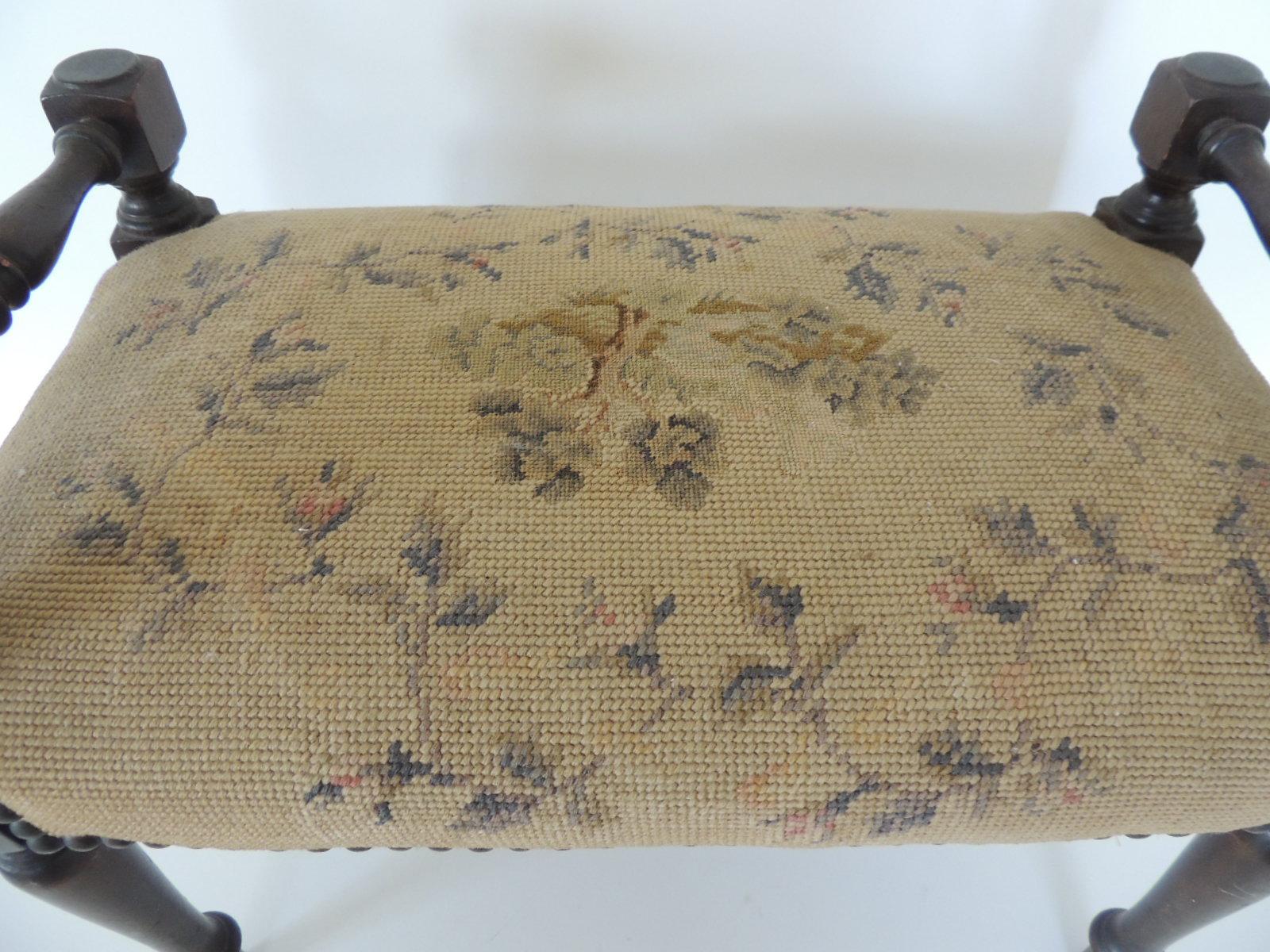 Antique needlepoint floral tapestry footstool.
Yellow and green tapestry stool, wood turned legs and antique nailheads
tacks all around. Very sturdy.
Size: 18