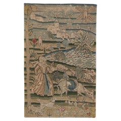 Antikes Bild mit Gobelinstickerei, das eine Dame in einer Landschaft darstellt
