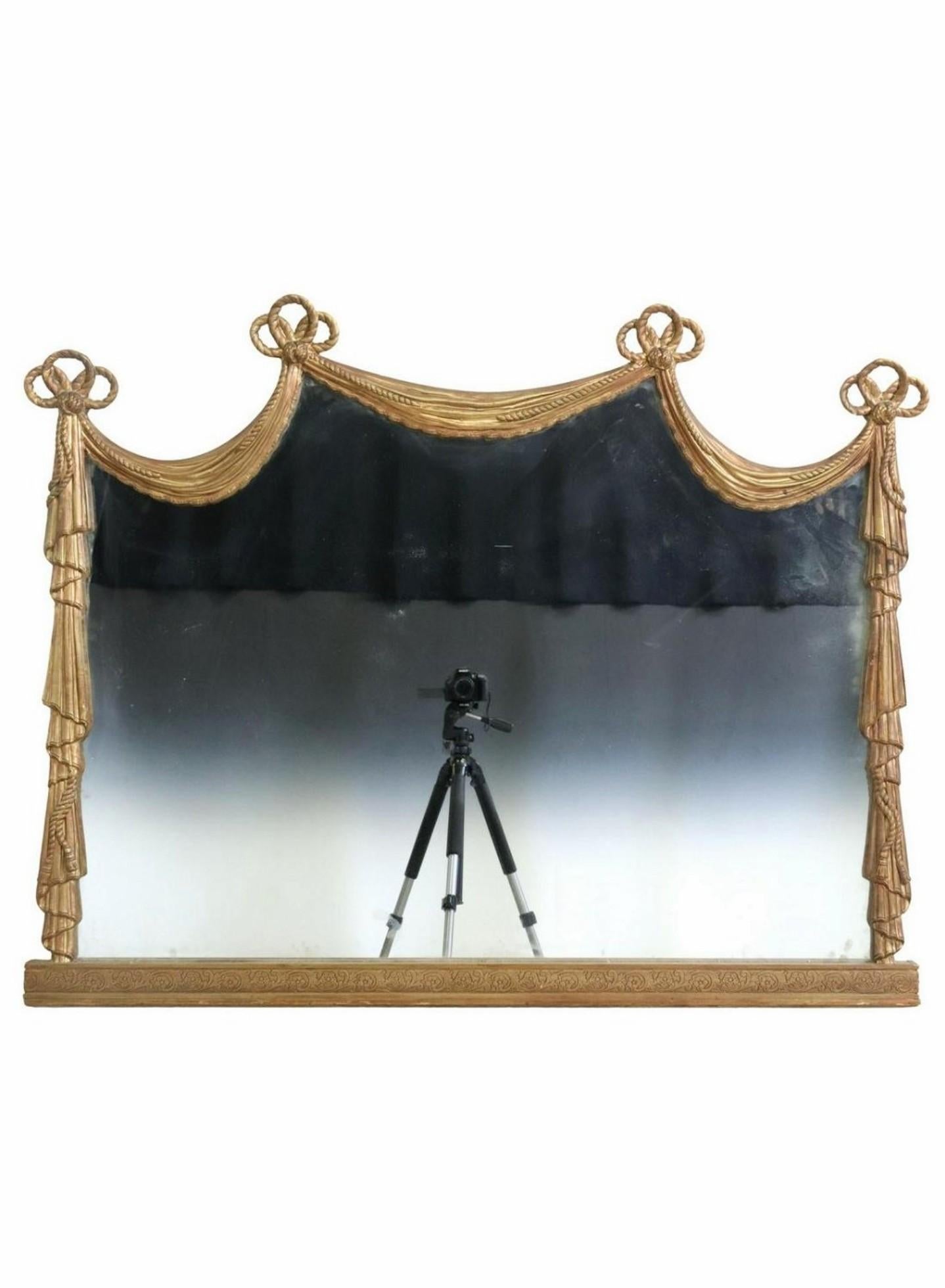 A stunning antique Italian Neoclassical Revival giltwood wall mirror / fireplace mantle mirror. circa 1900

Late 19th / early 20th century, exceptionally executed architectural window curtain frame shaped mirror, having a sculptural gilt painted