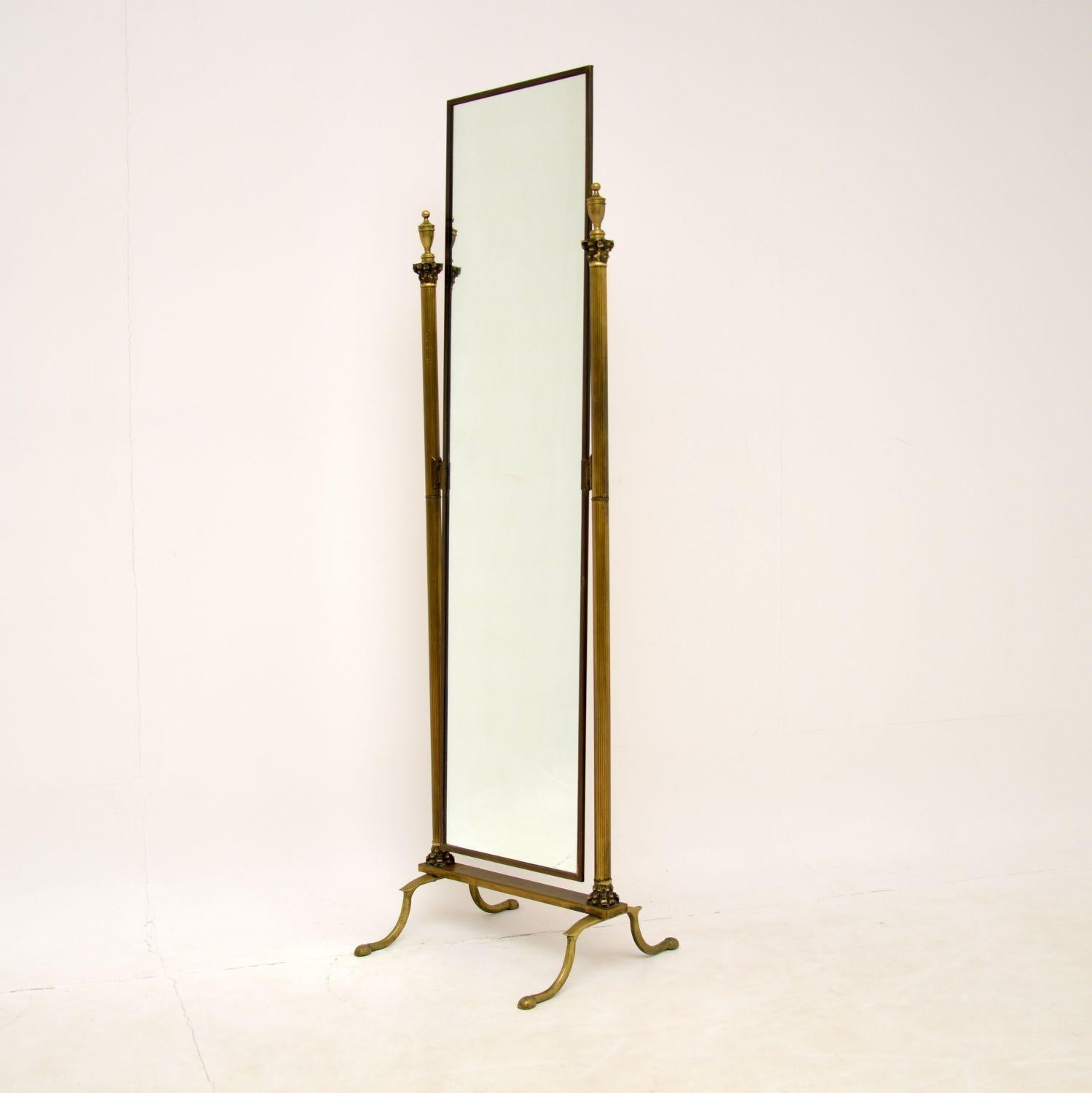 A fabulous solid brass cheval mirror, with beautiful neo-classical styling. This was made in England by Peerage, it dates from the 1960’s.

The quality is amazing, the supports are wonderfully shaped like Corinthian columns. The brass has a lovely