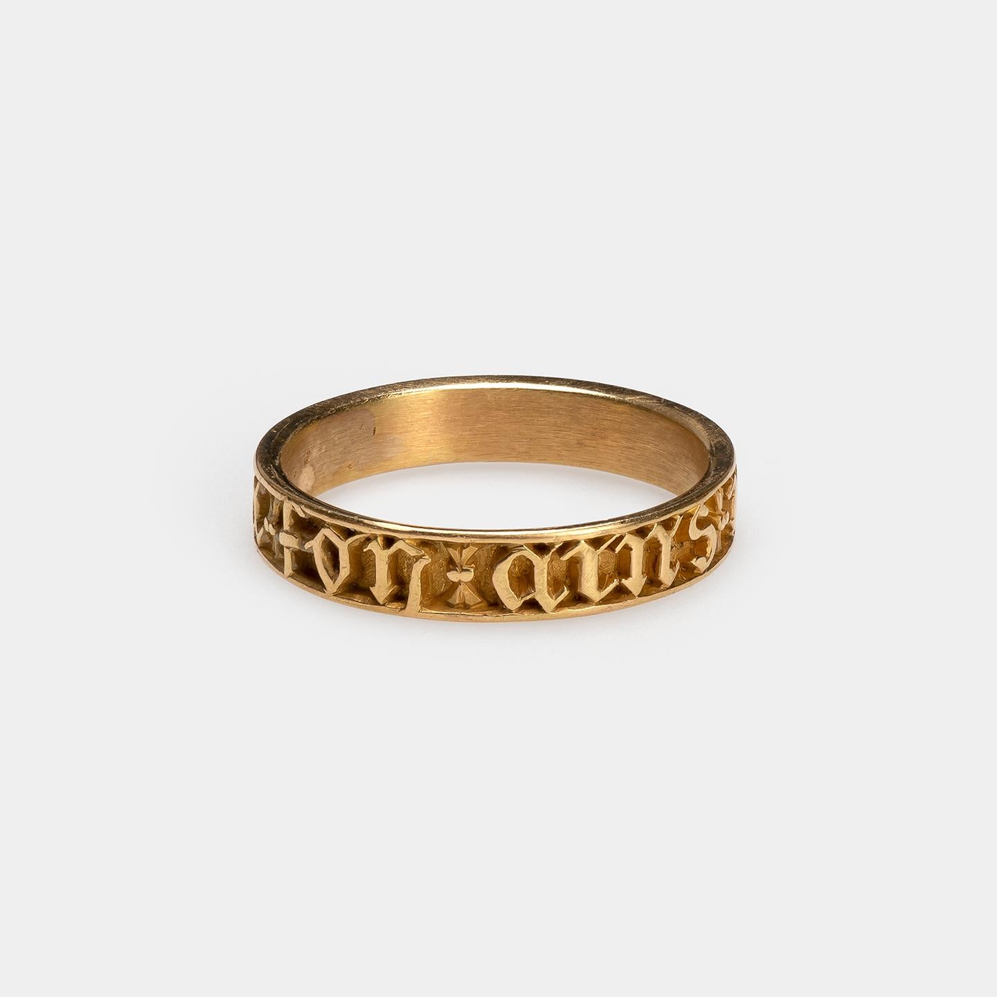 Neo-Gothic Ring with Inscription
Probably France, 19th century
Gold
Weight 3.9 gr; Circumference 61.29 mm; US size 9 3/4; UK size T

Charming Revival ring with Gothic lettering reminiscent of medieval manuscripts and jewelry

Plain gold band with a