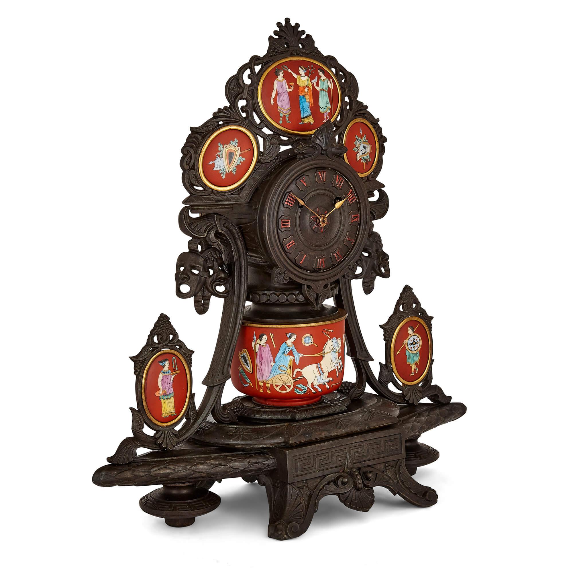 Antique Neo-Grec porcelain and cast iron clock set
French, 19th Century
Clock: Height 41cm, width 40cm, depth 16cm
Candelabra: Height 30cm, width 20cm, depth 13cm

This beautiful Neo-Grec style clock set is crafted from cast iron and red