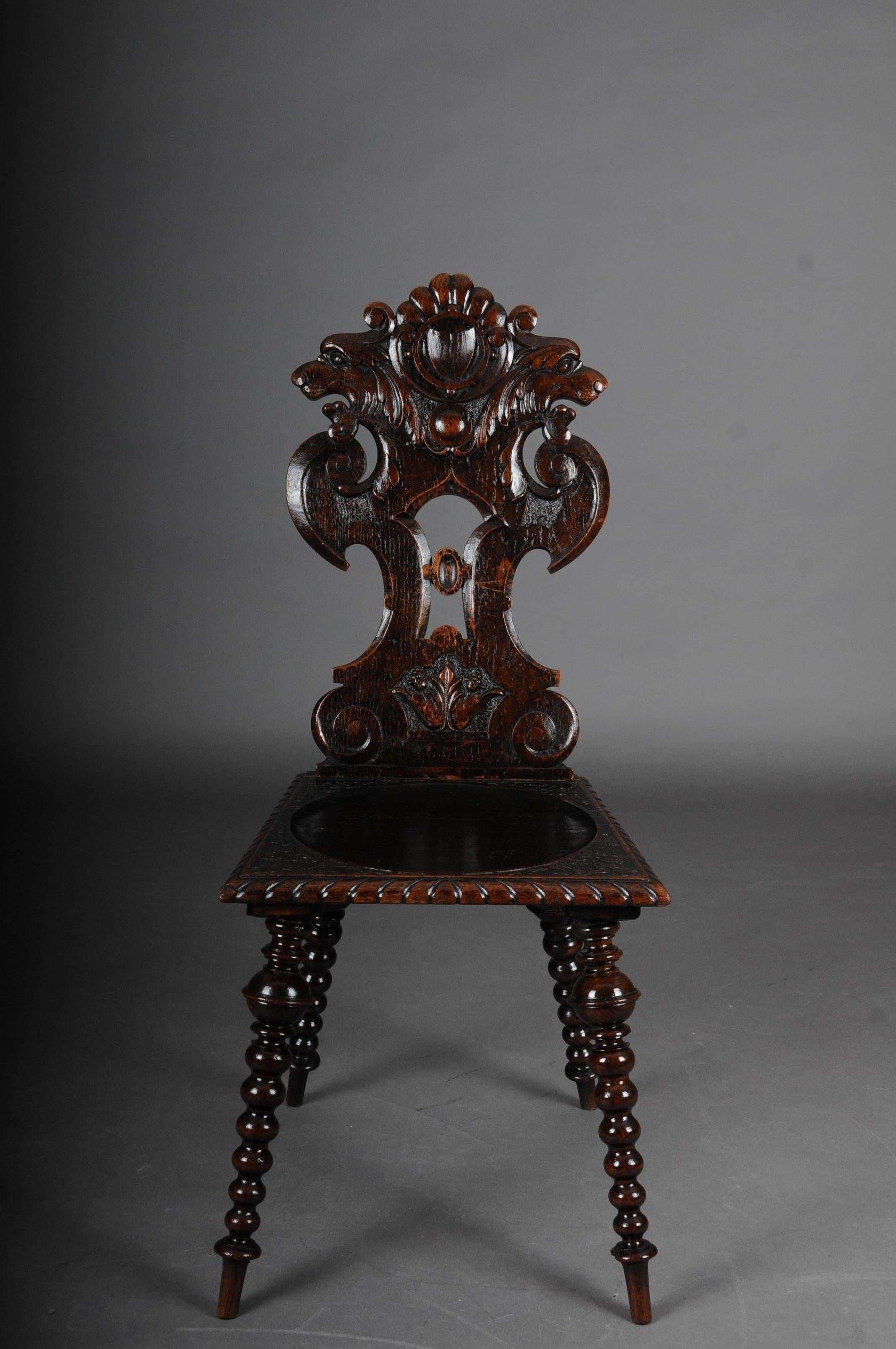 Antique neo Renaissance board chair historicism circa 1870, oak A.

Solid dark oak. Straight seat on turned and tapered legs.
Backrest with sculpted mythical animals. Extremely decorative and rare historicism chairs with rich carving.

(C-154).