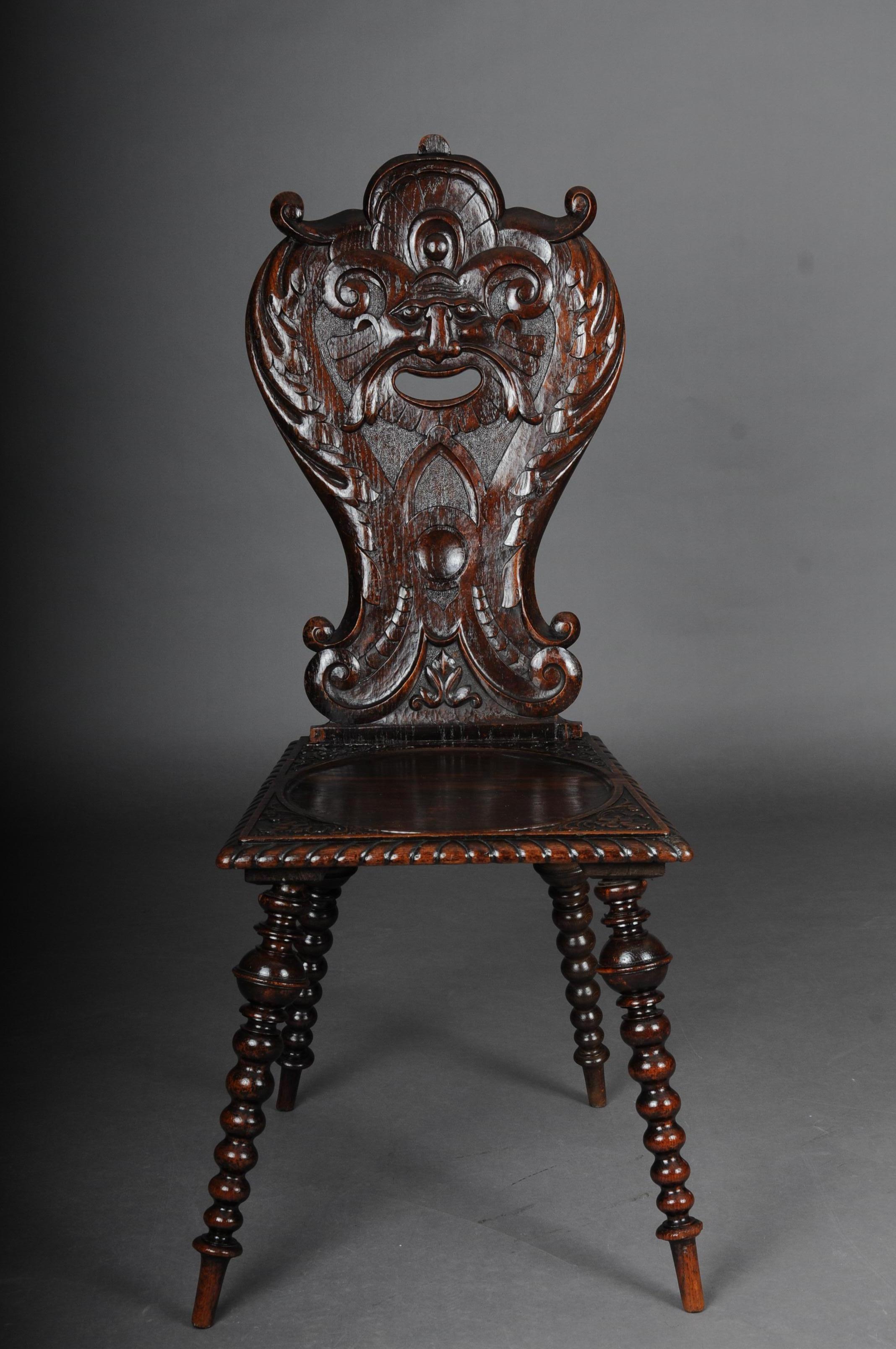 Antique Neo Renaissance board chair historicism circa 1870, oak B

Solid dark oak. Straight seat on turned and tapered legs.
Backrest with plastic carvings. Extremely decorative and rare historicism chairs with rich carving

(C-155).