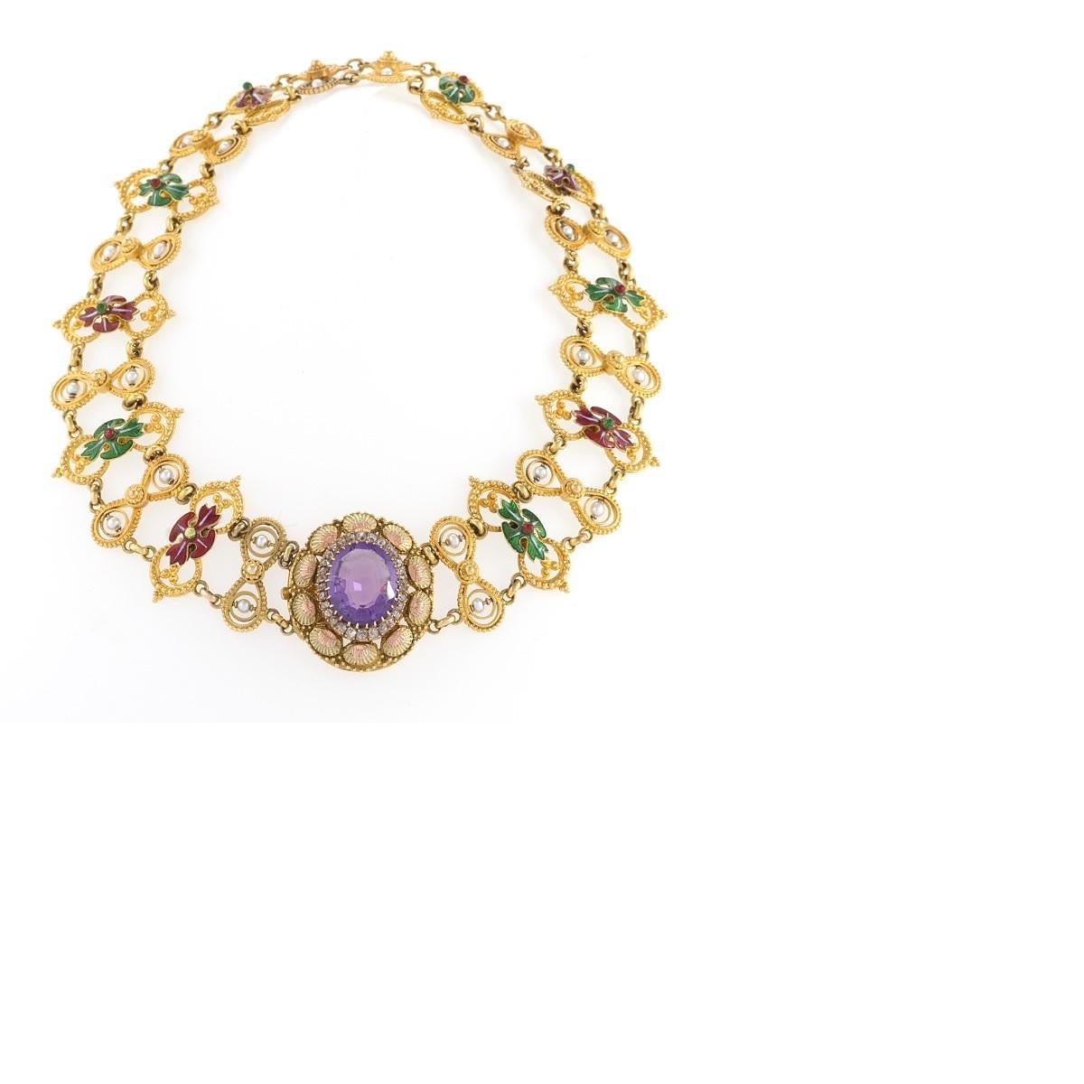 An English Antique 15 karat gold necklace with amethyst, diamond and natural pearl. The necklace has an oval cut amethyst approximately 9.50 carats, 30 old mine-cut diamonds with an approximate total weight of .30 carats, and 24 natural pearls