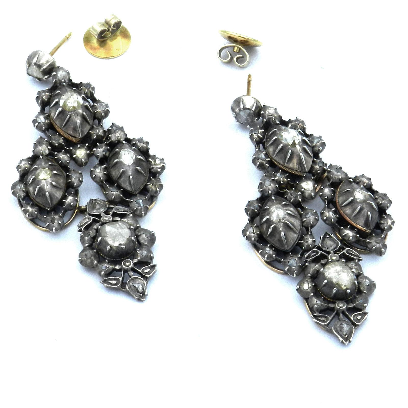 Antique Georgian Style Diamond Chandelier Earrings circa 1880

Magnificent and very decorative diamond earrings of impressive length with a diamond-set ear stud, suspending movable mounted pendants of four navette-shaped elements, each set with a
