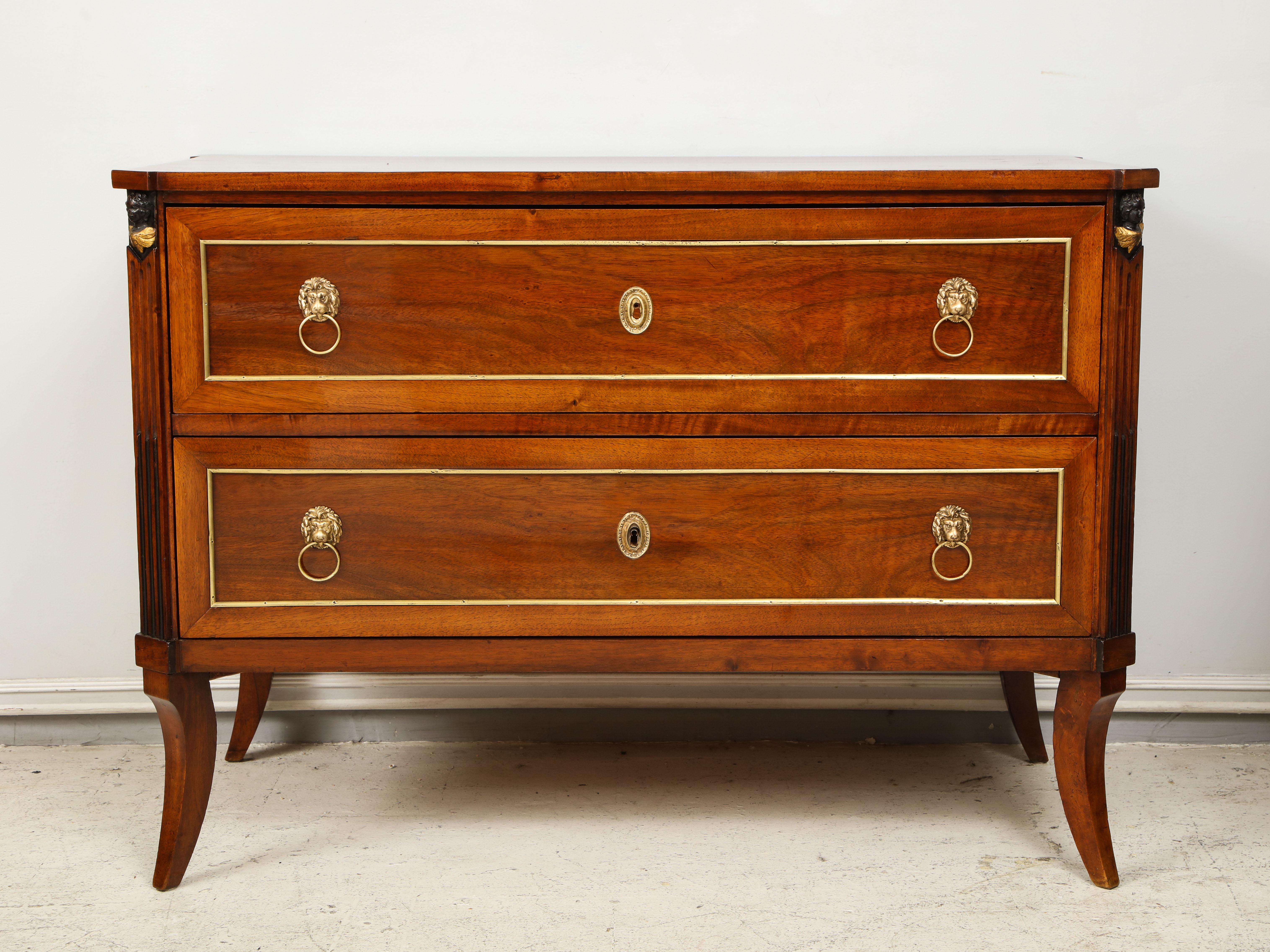 Antique neoclassic mahogany two-drawer commode on sabre legs.