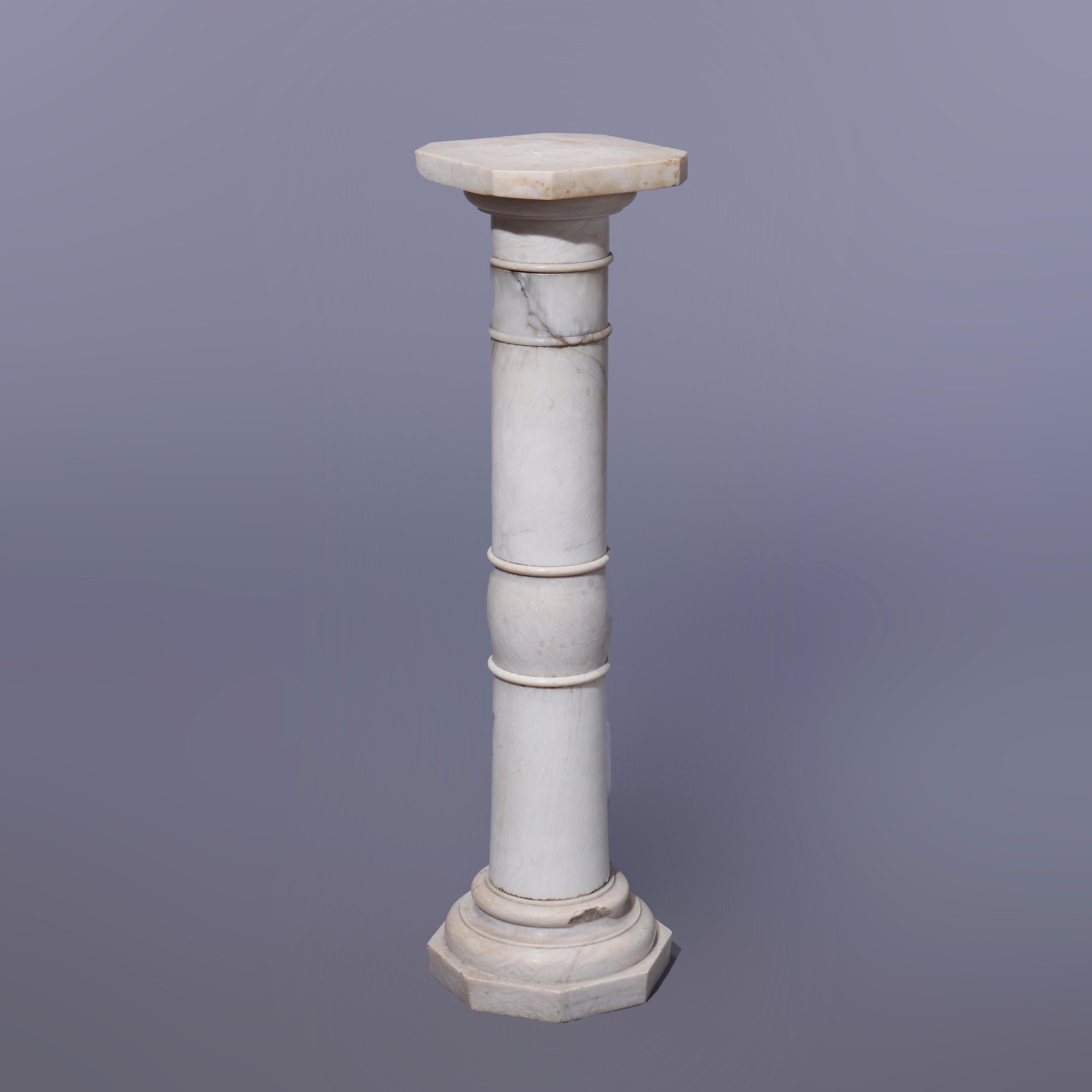 An antique neoclassical sculpture pedestal offers carved alabaster construction with clipped corner display over turned and banded Doric column raised on stepped base with octagonal foot, c1890

Measures - 35.75''h x 9.75''w x 9.75''d.

Catalogue
