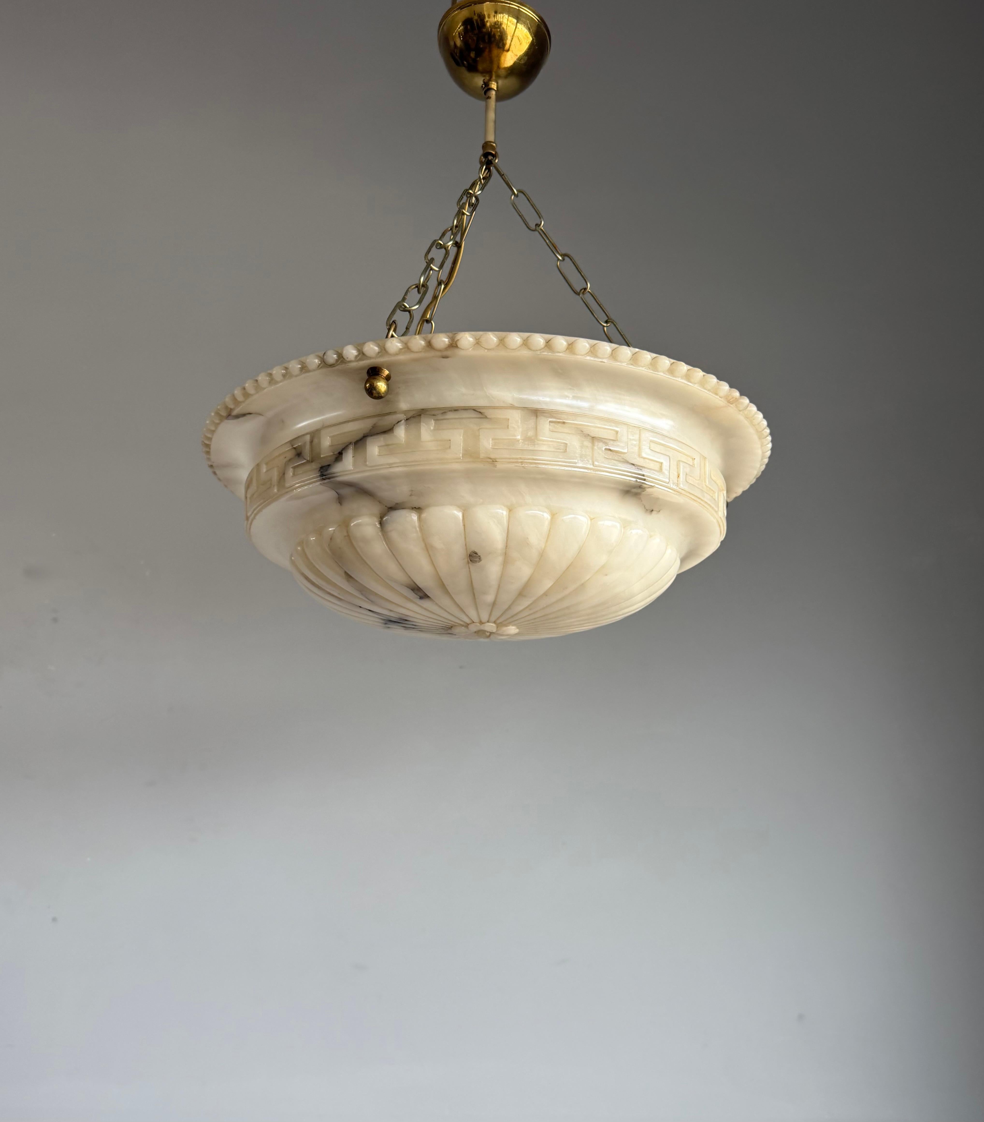 Exceptional antique alabaster ceiling fixture for an entry hall, bedroom or any other room.

A beautiful and authentic early 20th century alabaster pendant light in the neoclassical taste, with elegant carved detailing and wonderful natural veining.