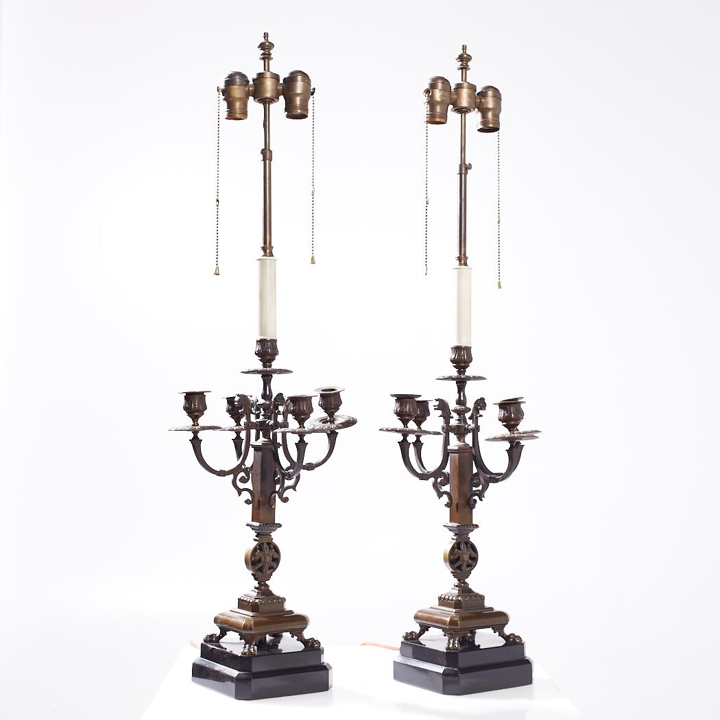 Antique Neoclassical Bronze Candelabra Lamps - Pair

Each lamp measures: 10.25 wide x 10.25 deep x 33.5 inches high

We take our photos in a controlled lighting studio to show as much detail as possible. We do not photoshop out blemishes. 

We keep