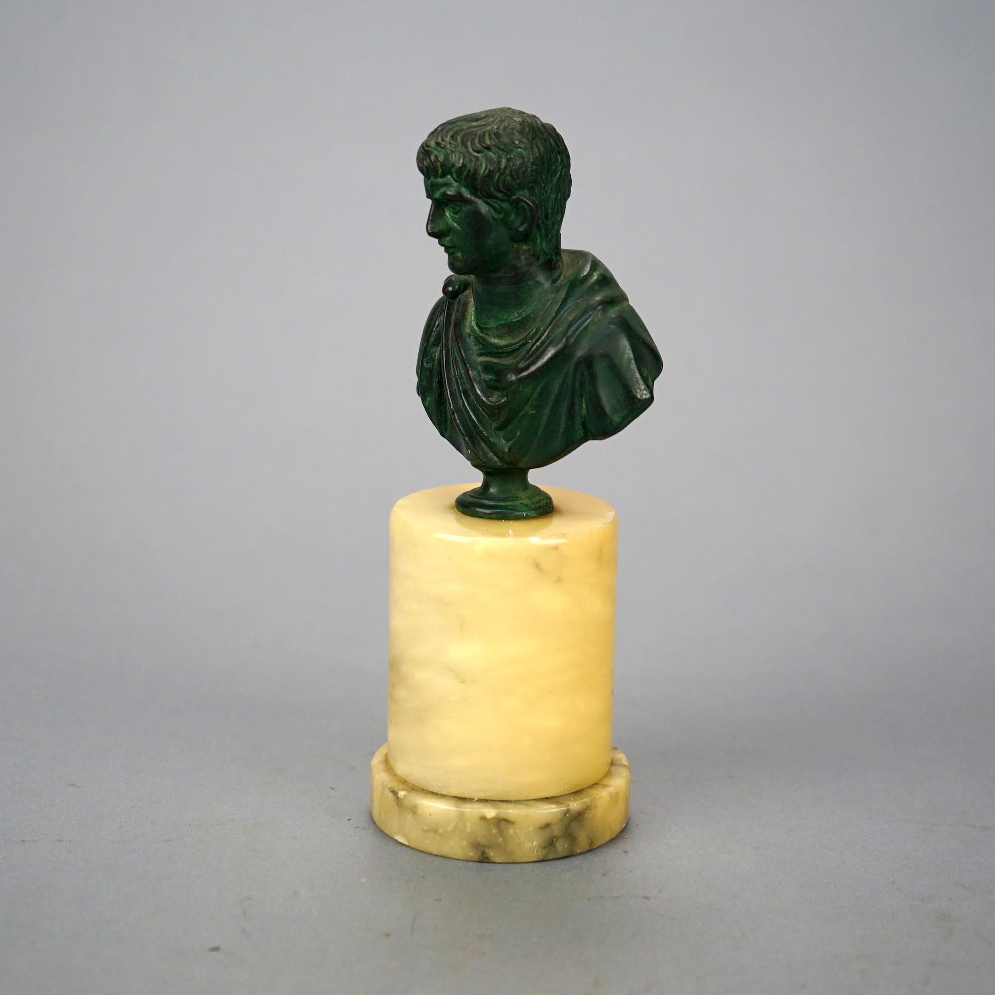 An antique Neoclassical portrait sculpture offers cast bronze bust of Caesar Augustus on marble plinth, c1900

Measures- 7.75'' H x 3.25'' W x 2.75'' D.