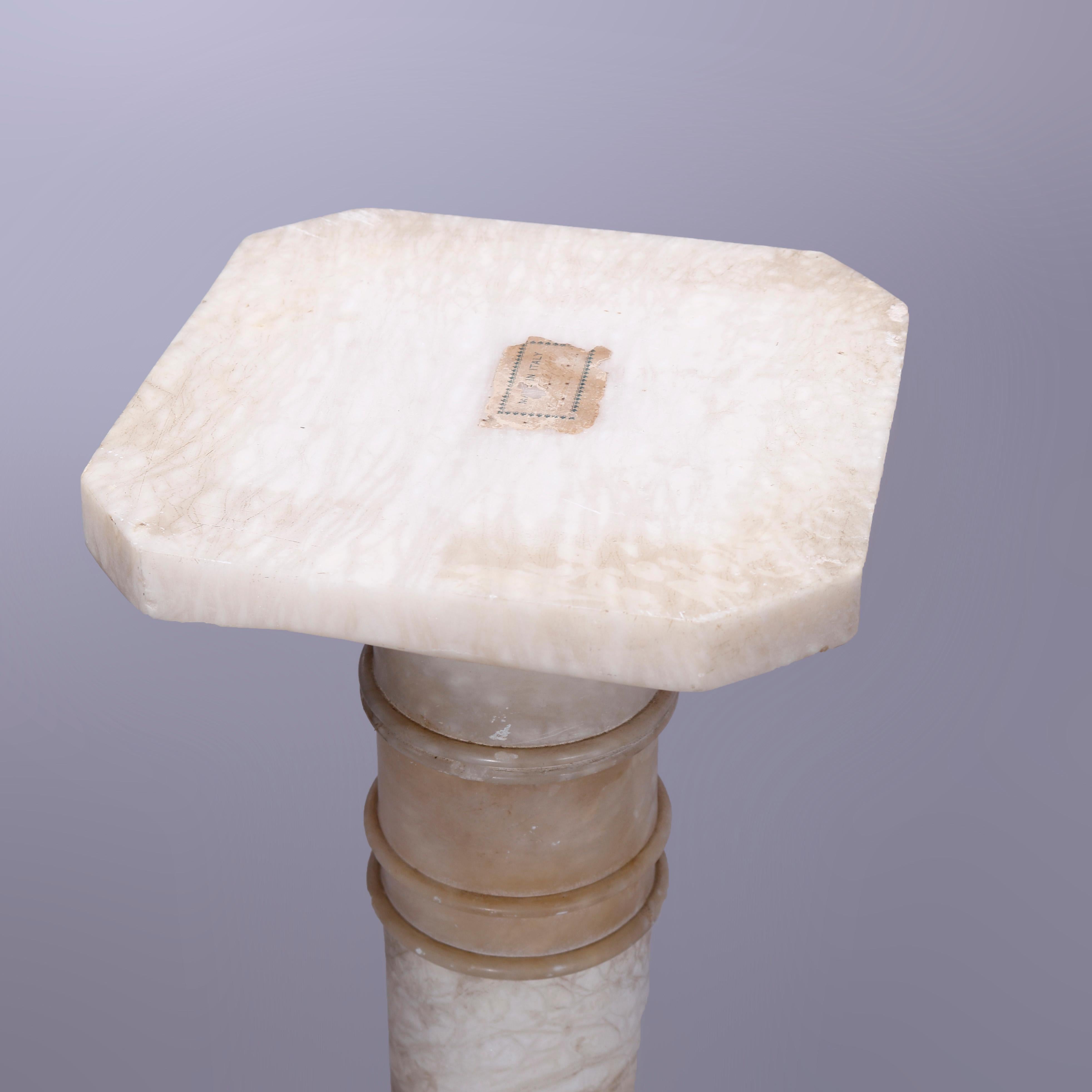 An antique Neoclassical sculpture pedestal offers carved marble construction with clipped corner square display over flared and banded column, raised on stepped base, c1890

Measures: 38.5