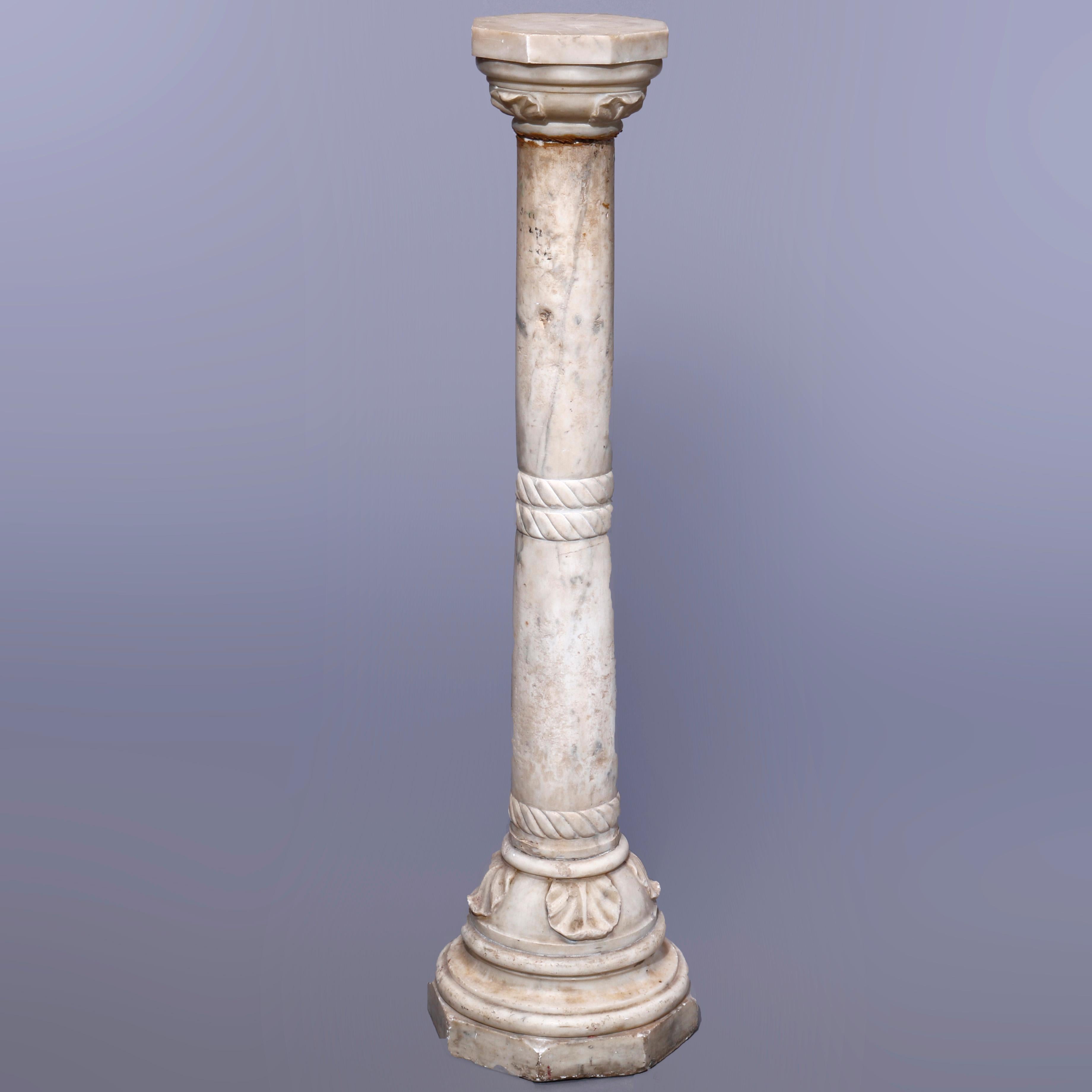 An antique neoclassical sculpture pedestal offers carved marble construction with octagonal display over turned and banded Doric column with carved acanthus foliate elements raised on flared base with octagonal foot, c1890

Measures - 48''h x
