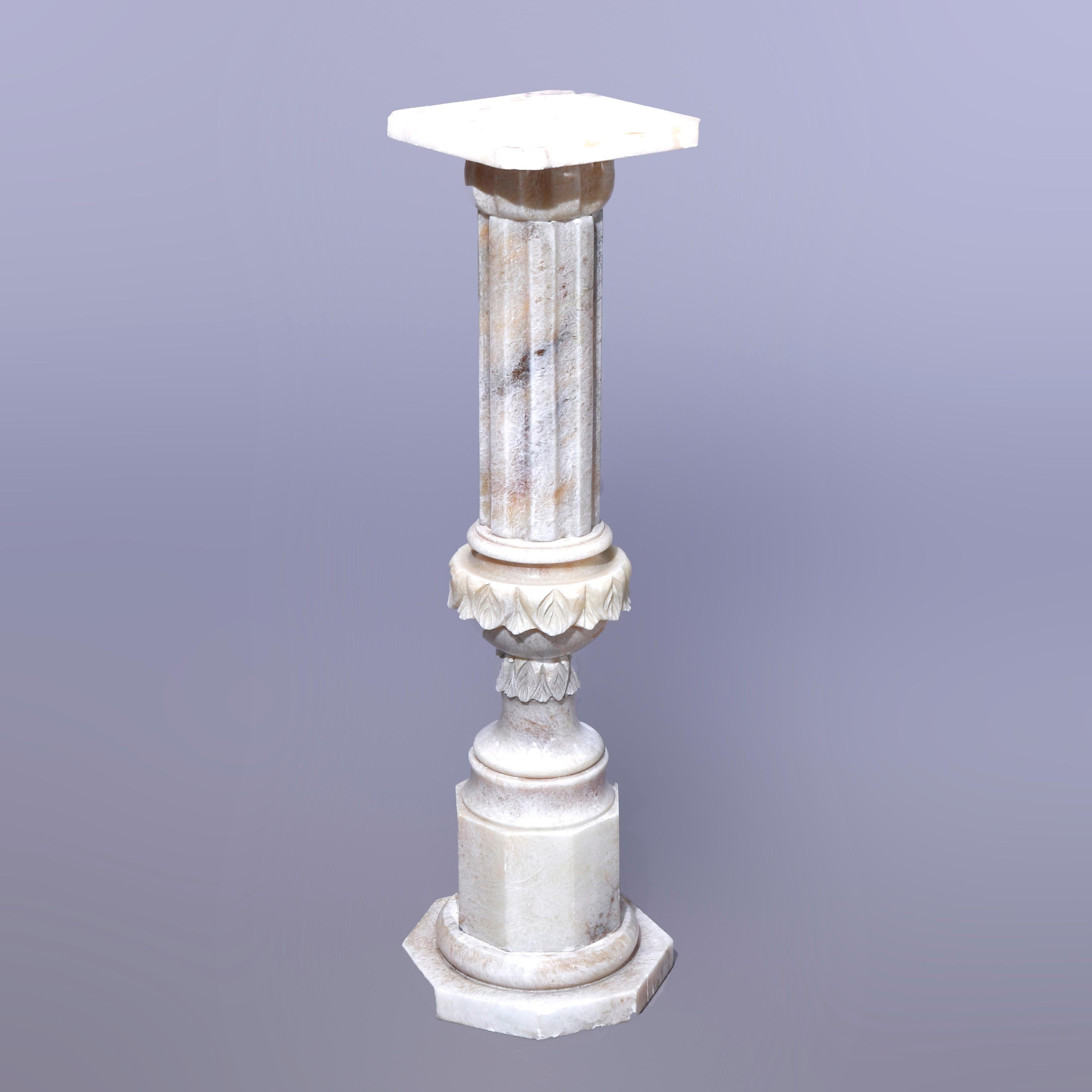 An antique neoclassical sculpture pedestal offers carved marble construction with clipped corner display over stylized urn form column on faceted base with octagonal foot, c1890

Measures - 36.75'' H x 10.5'' W x 10.5'' D.

Catalogue Note: Ask about
