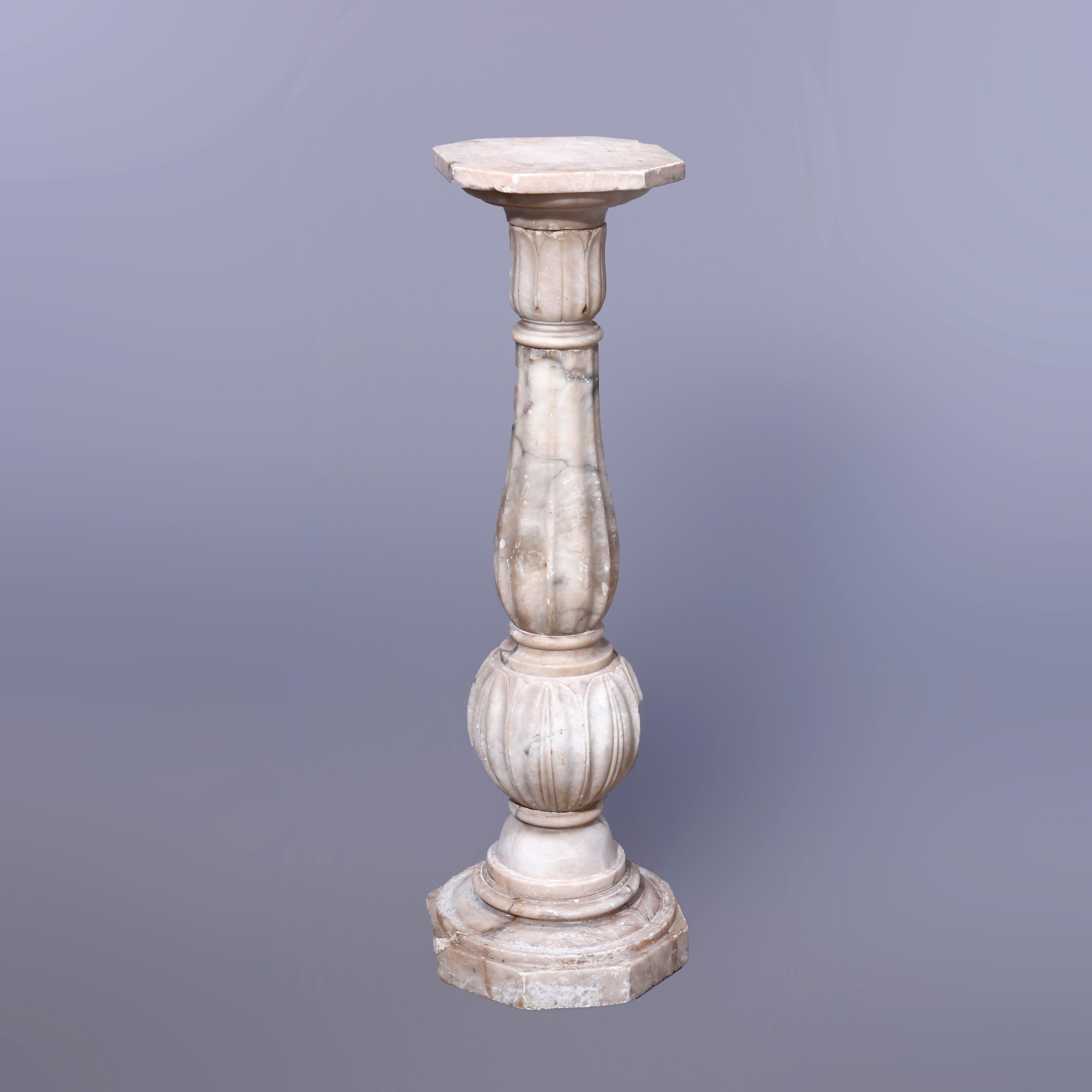 An antique neoclassical sculpture pedestal offers carved marble construction with clipped corner display over melon reeded column having acanthus foliate bands, raised on flared base, c1890

Measures - 40.5''H x 12.5''W x 12.5''D.

Catalogue Note: