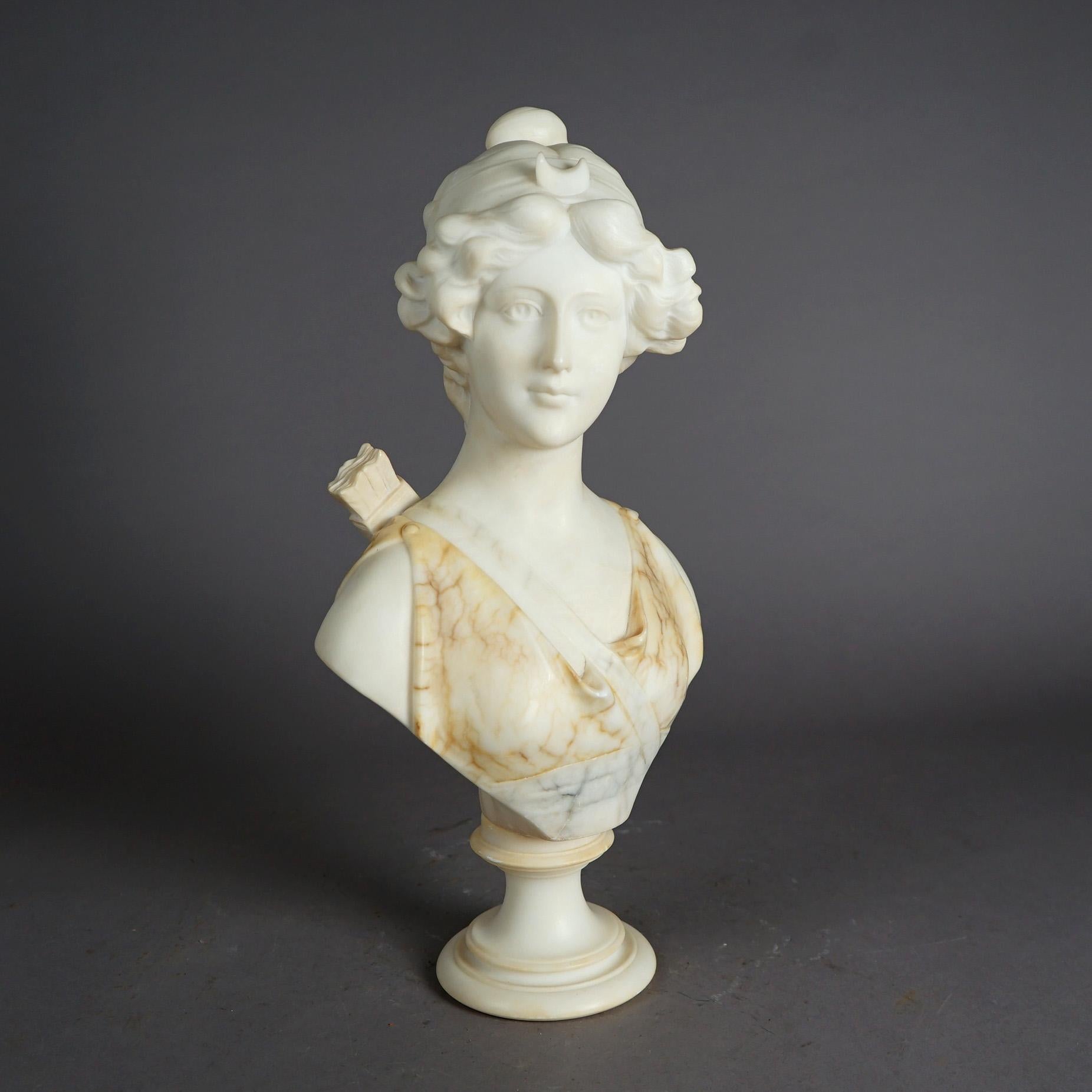 An antique Neoclassical sculpture offers carved bi-color marble bust of Diana the Huntress on round marble plinth, c1890

Measures - 20